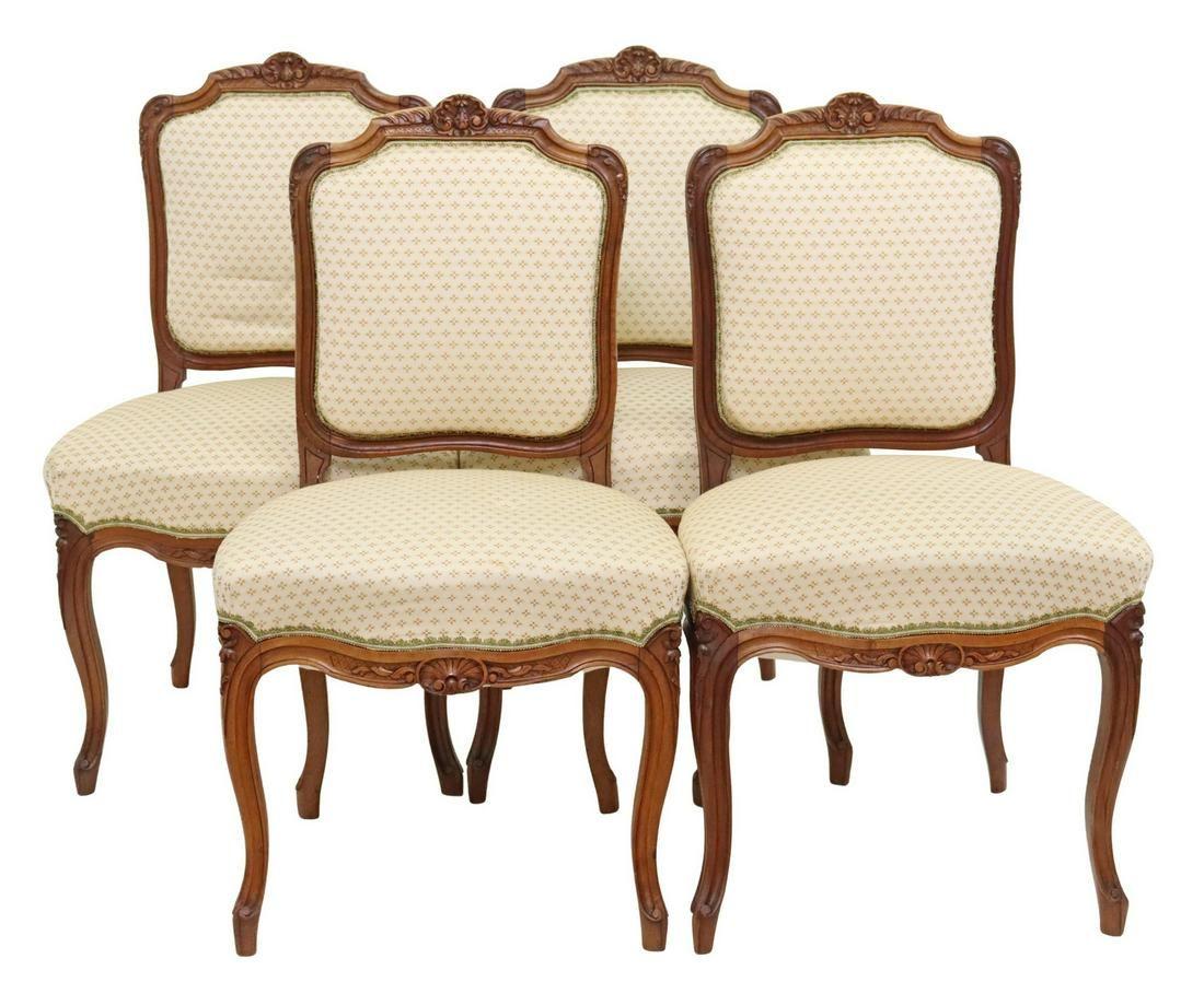 (lot of 4) French Louis XV style side chairs, 20th c., having carved rocaille crest, in a floral upholstery, above shell motif apron, rising on cabriole legs, ending on whorl feet.

Dimensions
approx 36.25