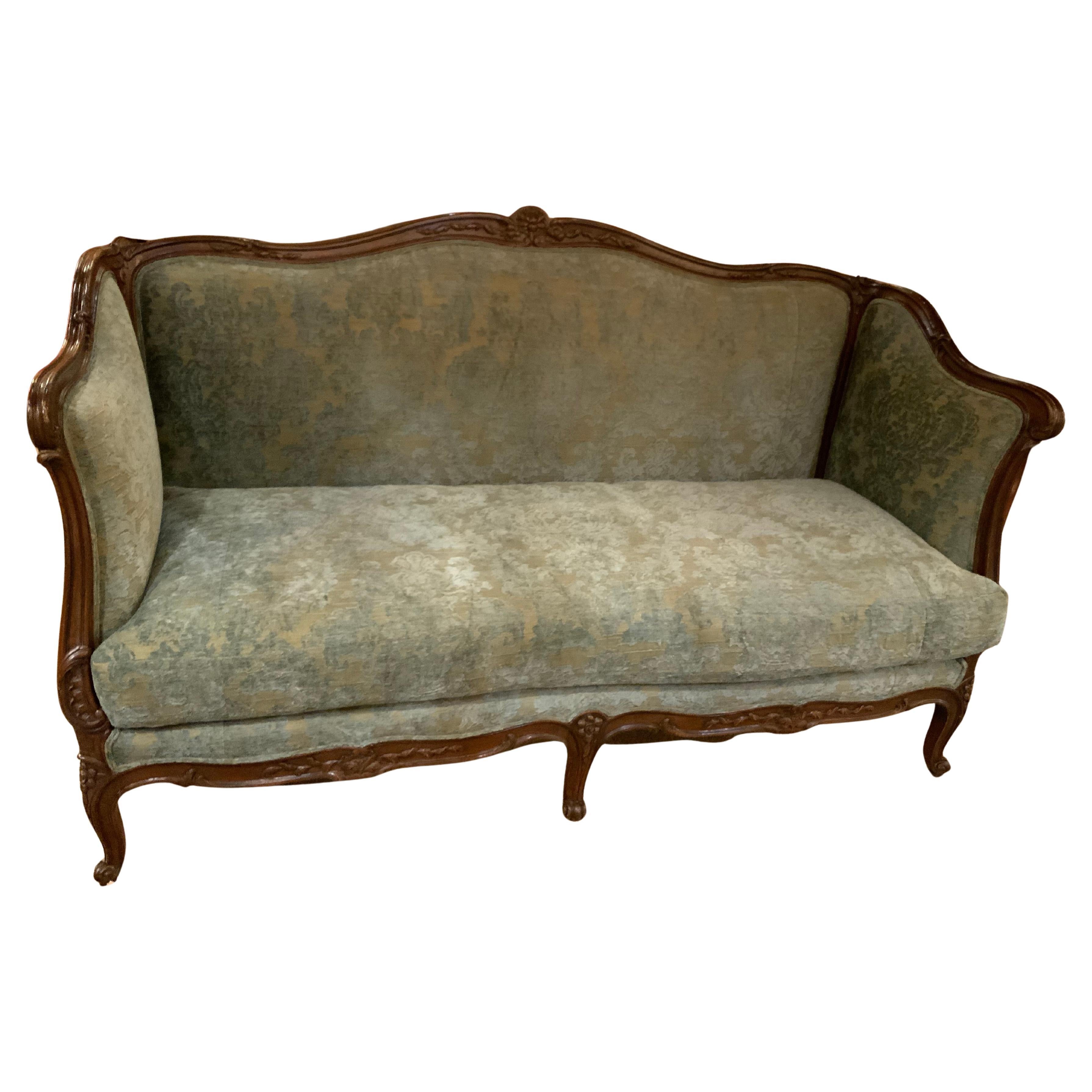 French Louis XV Style walnut carved sofa, 19 th c.