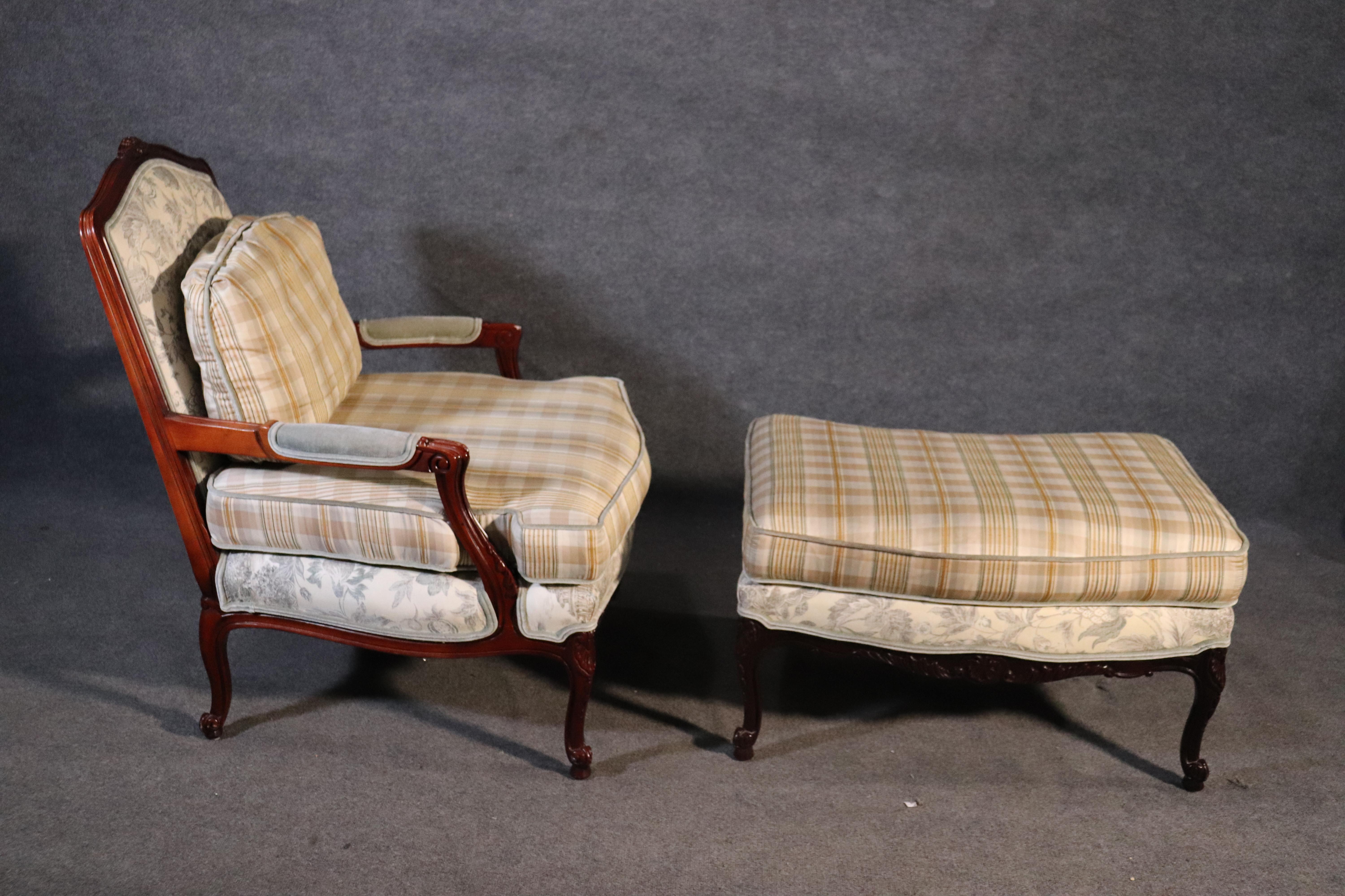 This is a beautiful custom made chair and ottoman made by Taylor-King of North Carolina. The chair is in very good condition with minimal signs of use at all. The upholstery is extremely attractive toile and gingham printed fabric. The chair