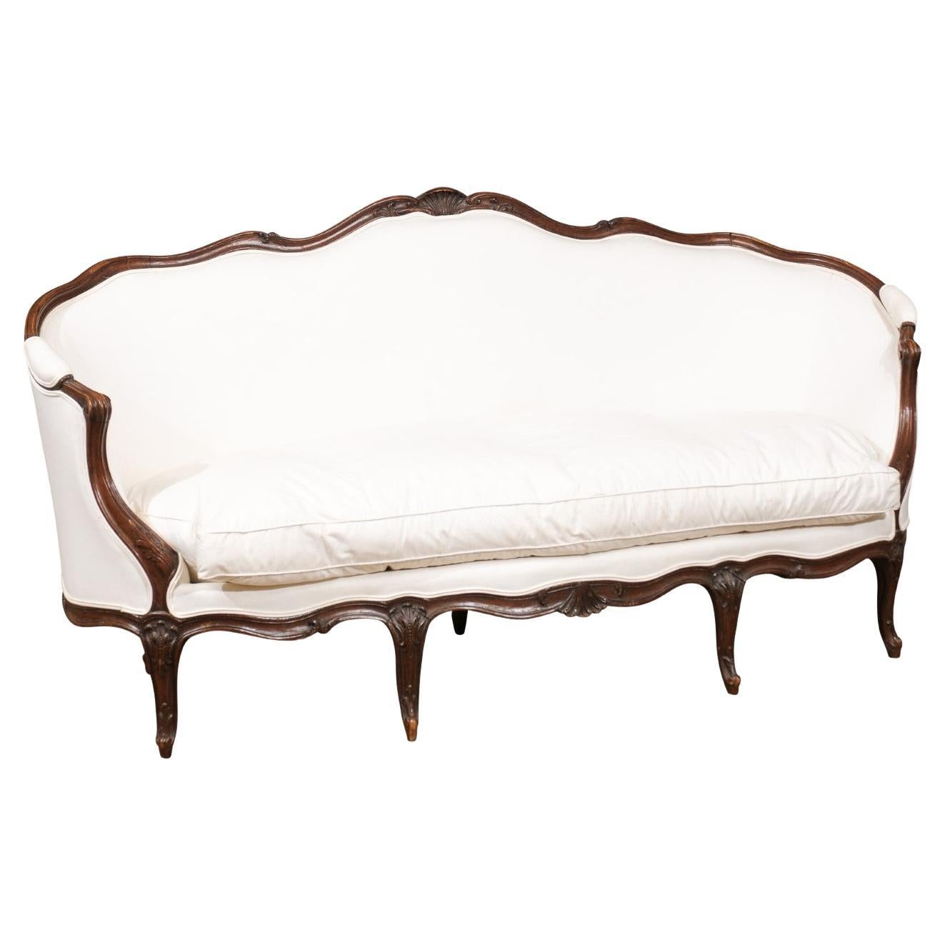 French Louis XV Style Walnut Upholstered Canapé with Wraparound Back, circa 1850 For Sale