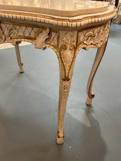 French Louis XV style white painted center table with gilt accents, marble top