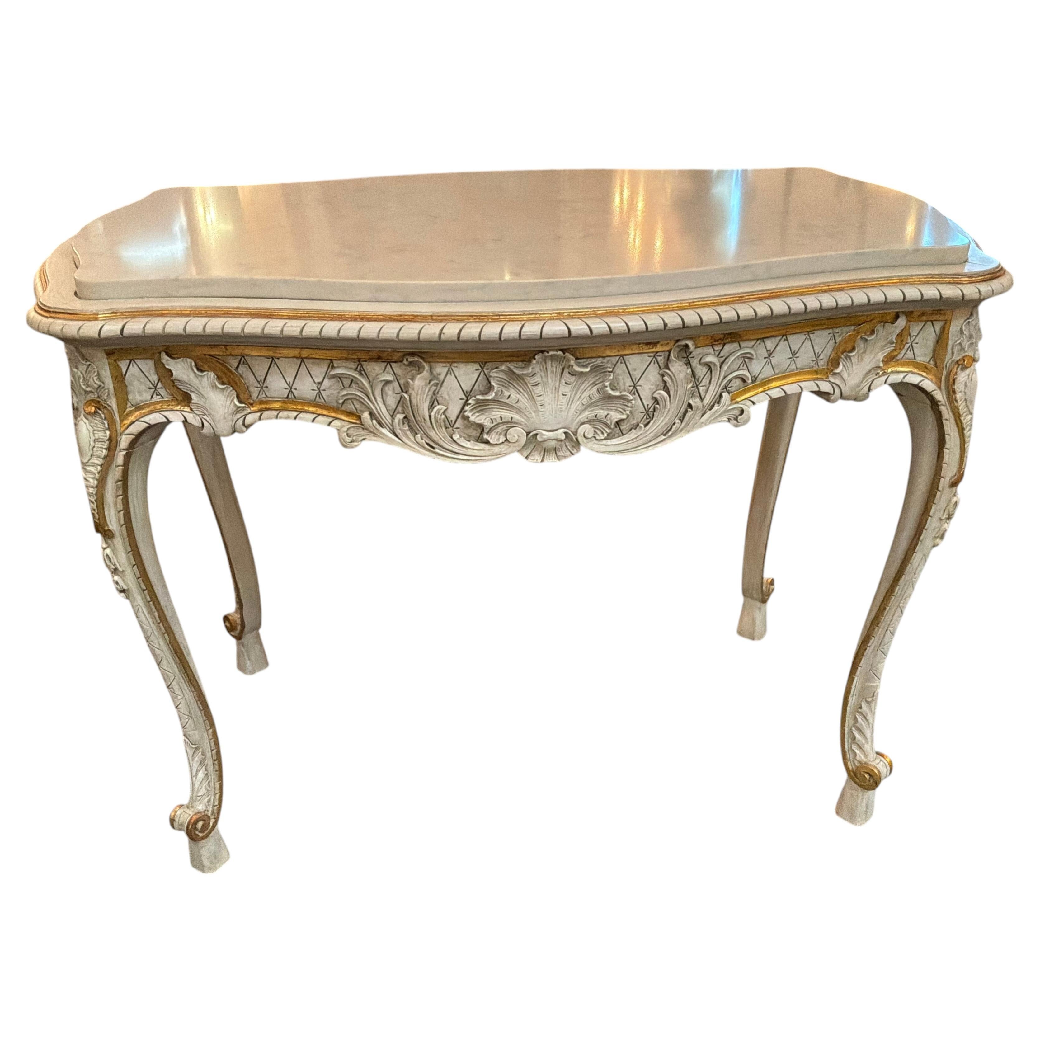 French Louis XV style white painted center table with gilt accents, marble top