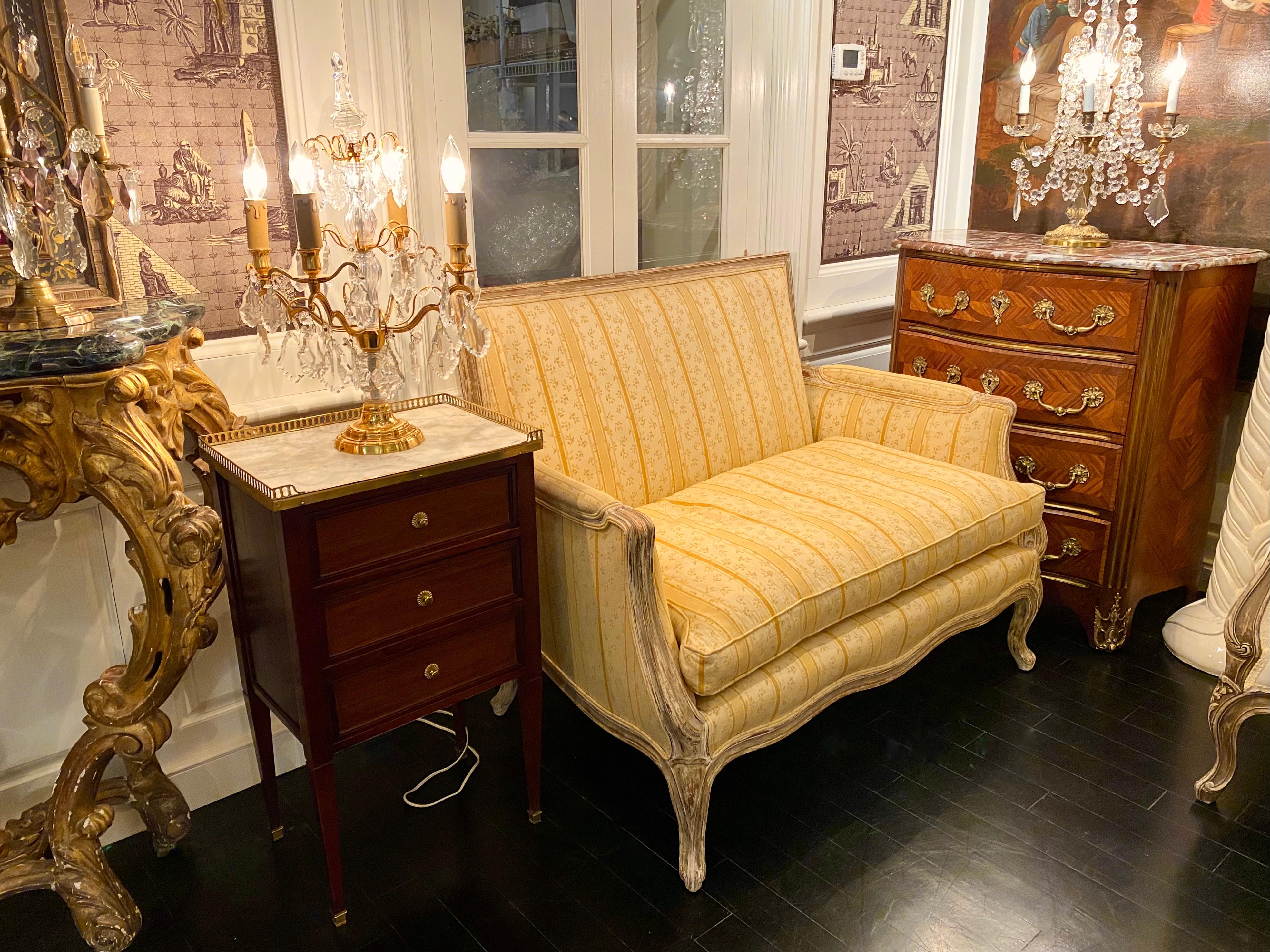 French Louis XV transition provençal settee, patinated wood frame, recent pale yellow down upholstery in pale yellow stripes and greenery. 
Though the feet are in the Style of Louis XV, the square back frame evoke the beginings of Louis XVI Style,