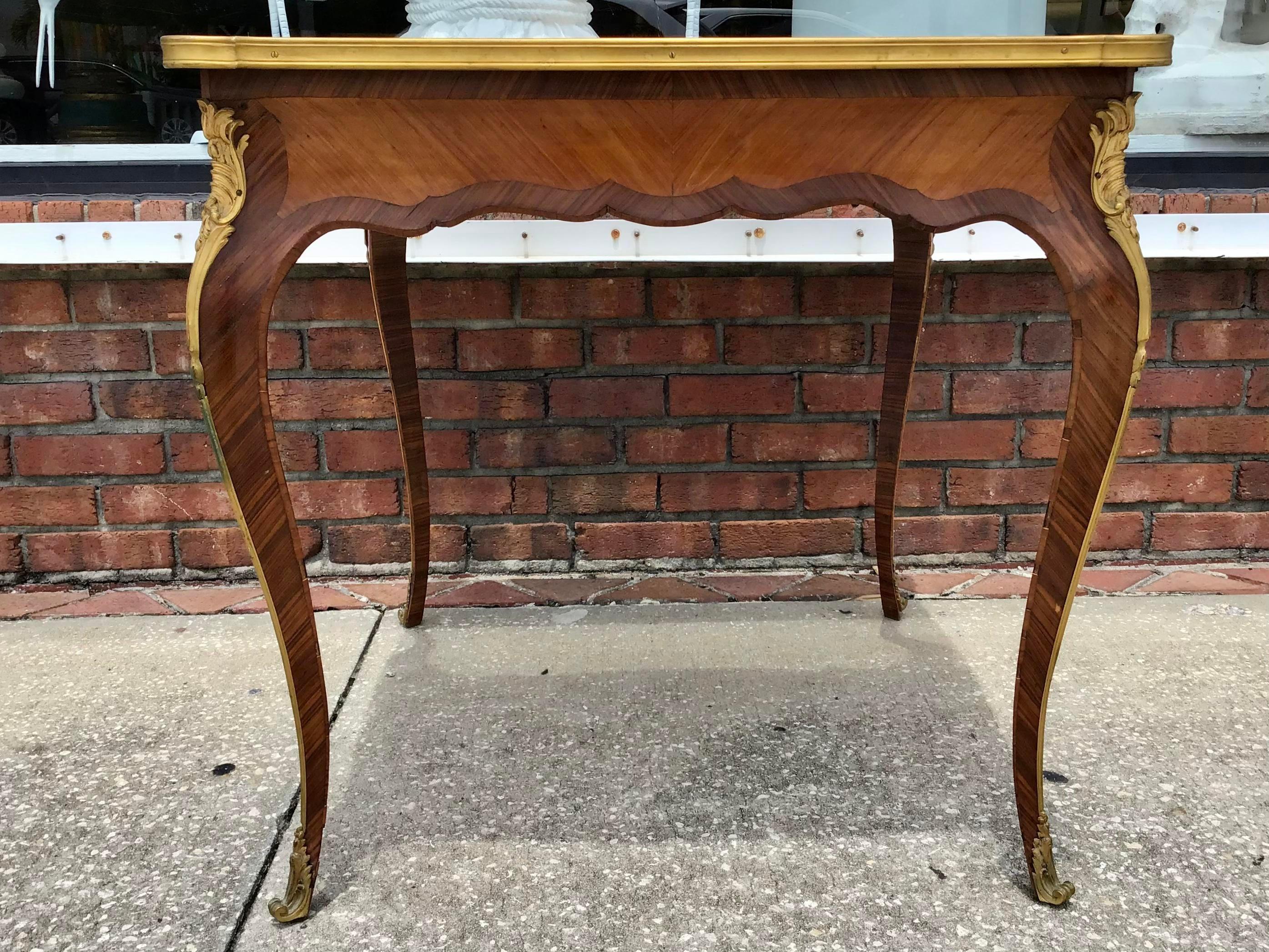 Classic French Louis XV transition square center table or game table with fabulous bronze ormolu mounts. Perfect marquetry detail in the wood pattern make this a French classic. Just gorgeous and so useful. Even use it as a small dining table!