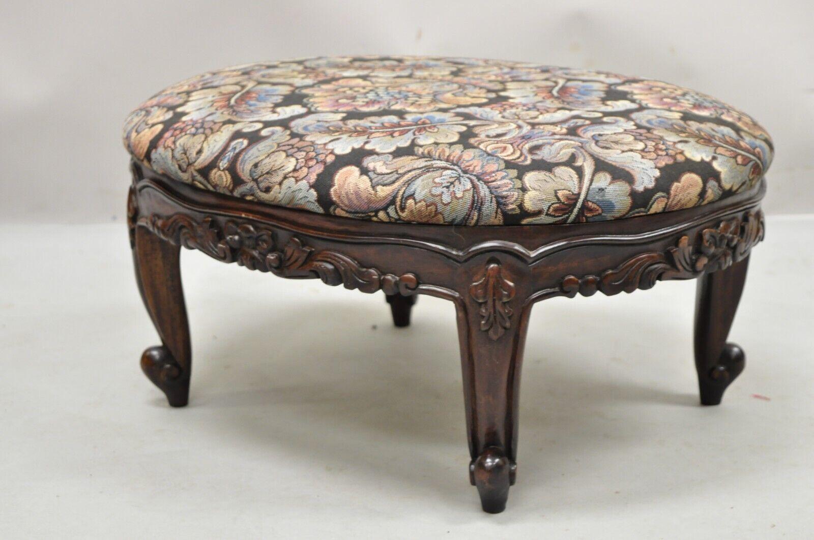 French Louis XV Victorian style carved wood 22 inch oval small Footstool ottoman. Item features a solid wood frame, beautiful wood grain, clean modernist lines, quality American craftmanship. Circa late 20th - Early 21st century. Measurements: 10