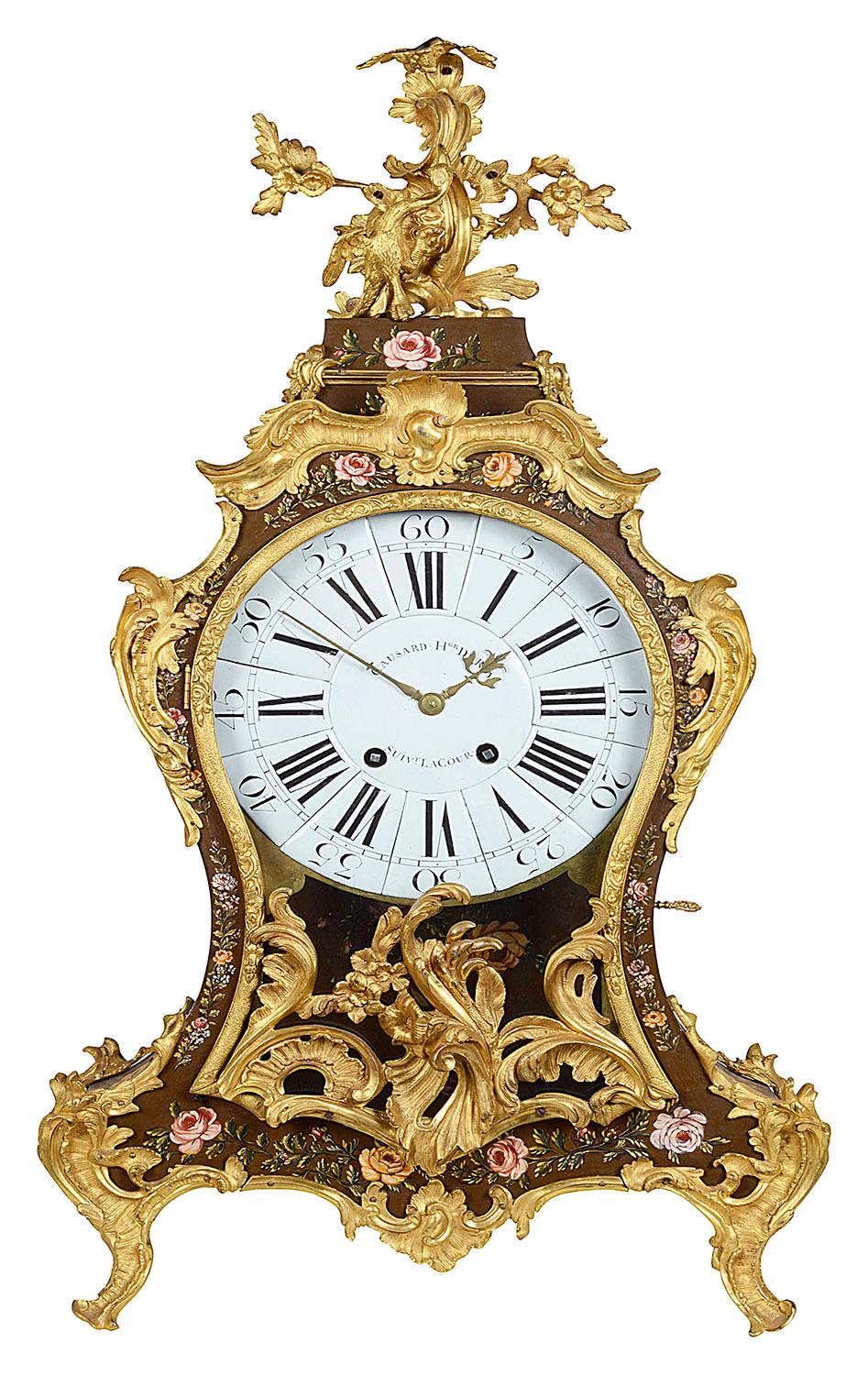 An impressive French 18th century, Louis XV period bracket clock, having wonderful Rococo style gilded ormolu scrolling mounts. the caddy top with a Ho Ho bird among foliage, the waisted case with glazed panels to the sides and hand painted flowers.