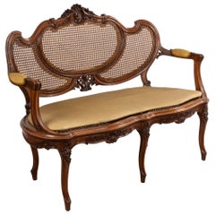 Loveseat francés Luis XV de nogal