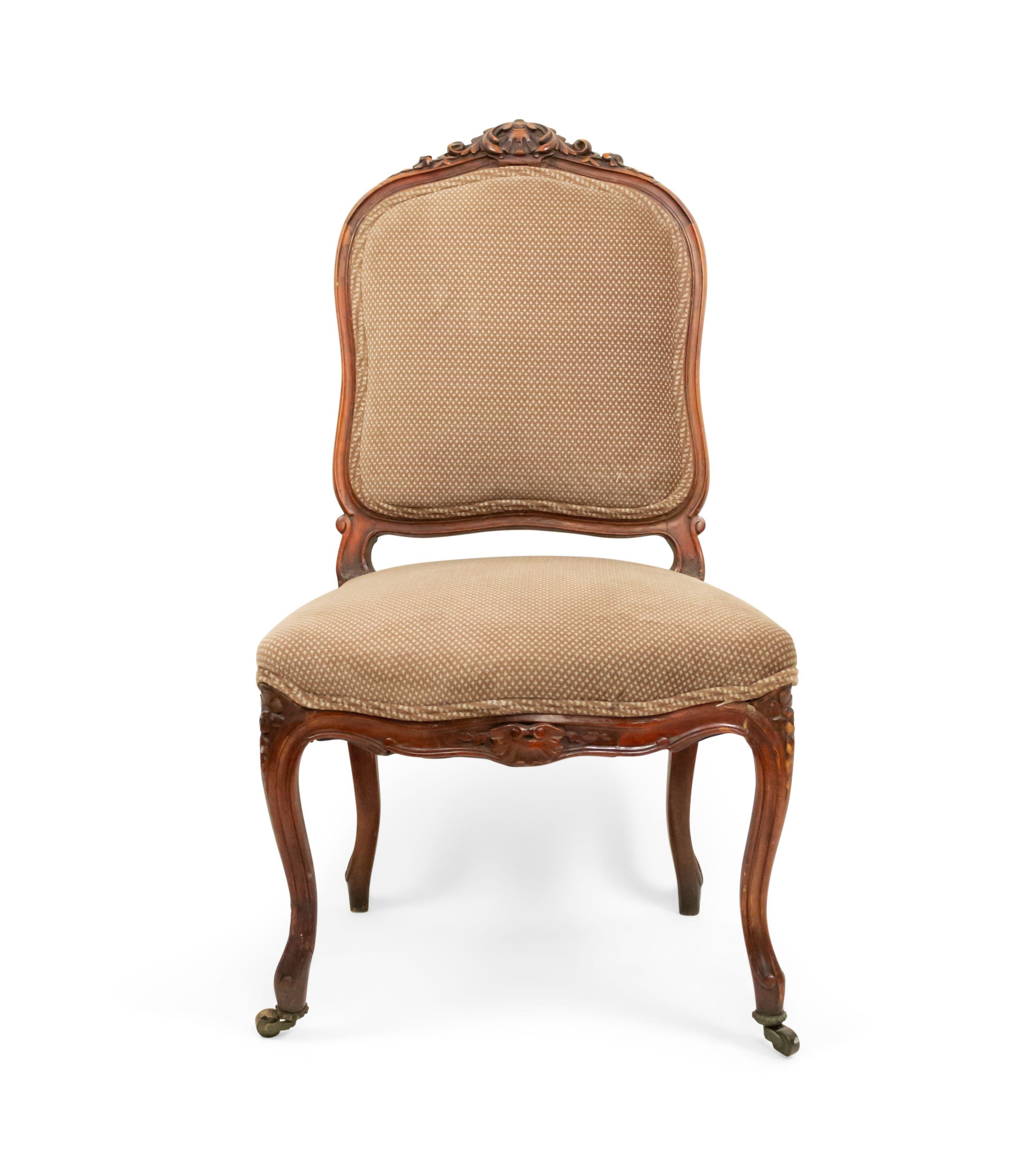 Pair of 19th century French Louis XV style walnut side chairs with a carved back crest and brown upholstered seat and back (1 leg as is).