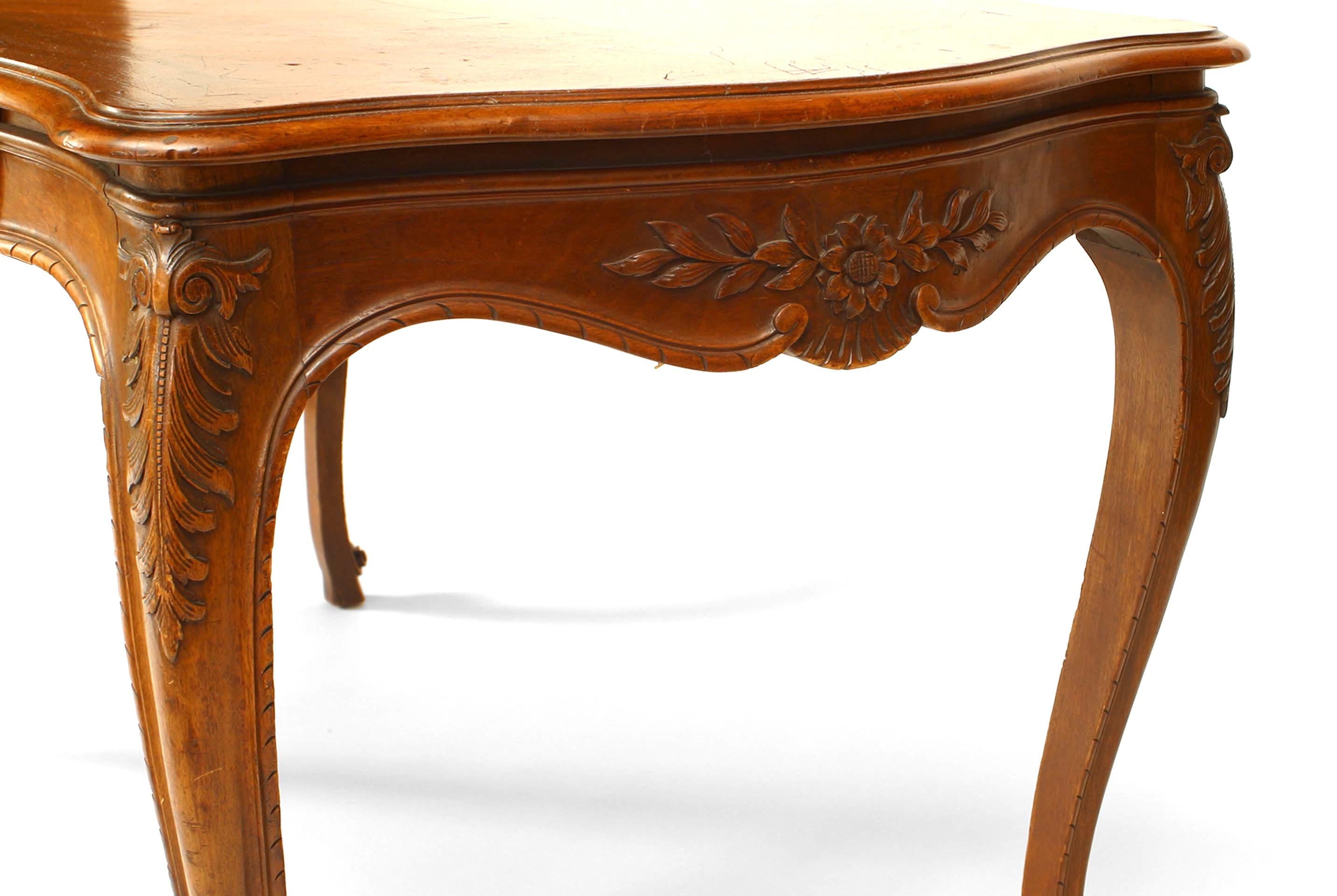 French Louis XV style walnut table desk with drawer and carved apron.