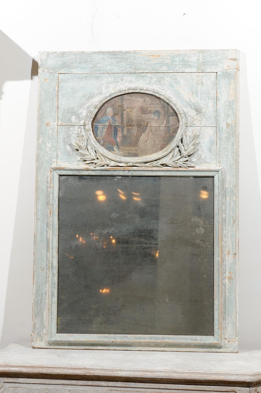 A French Louis XVI period painted trumeau mirror from the late 18th century, with oval painting. Created in France during the tumultuous last decade of the 18th century, this painted trumeau mirror attracts our attention with its linear silhouette