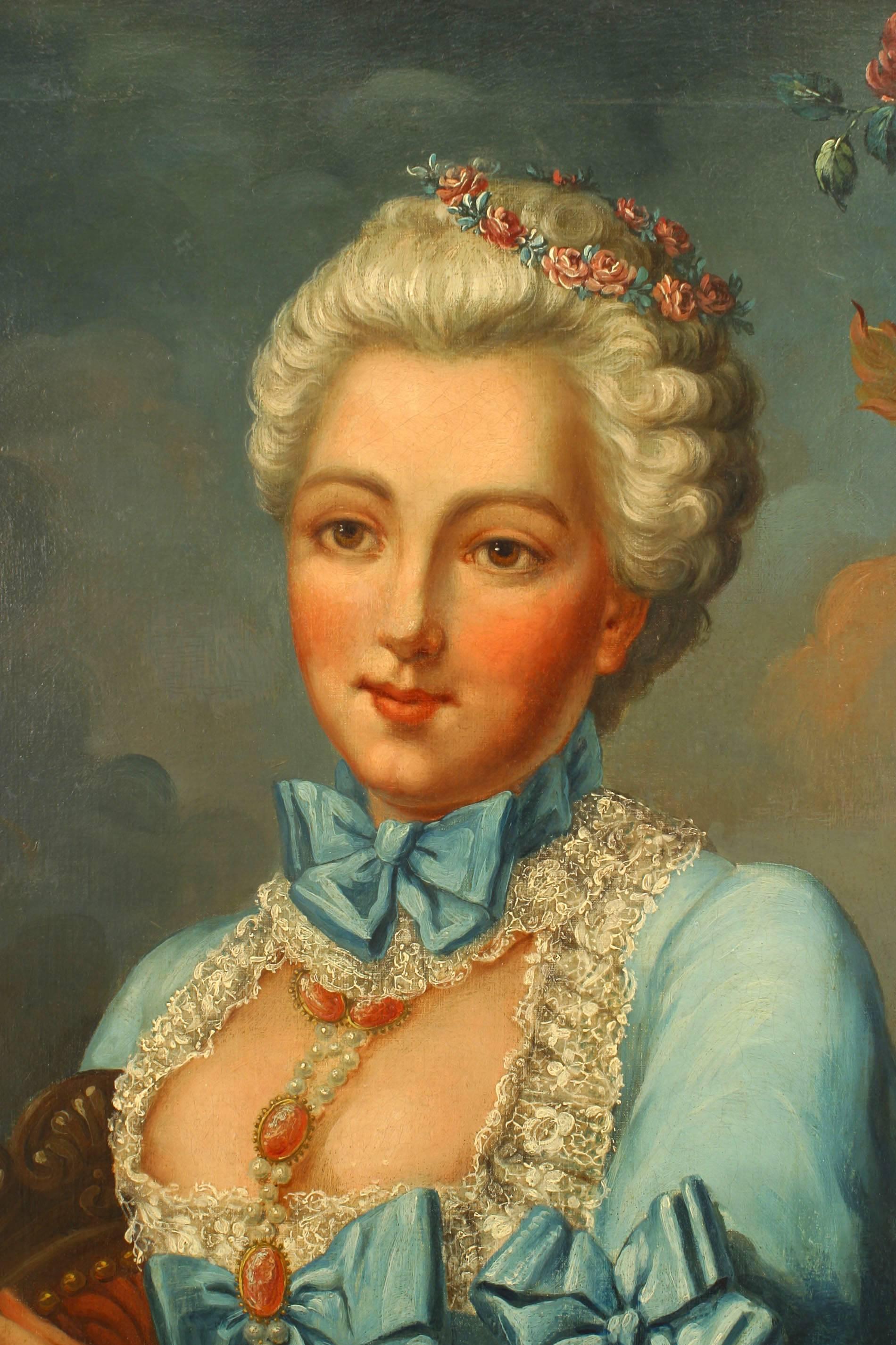 French Louis XVI (18th Cent) oil painting portrait of a lady in a blue dress with lace trim & flowers in her hair holding a book seated next to a large urn in a stripped carved frame (att: NATTIER)
