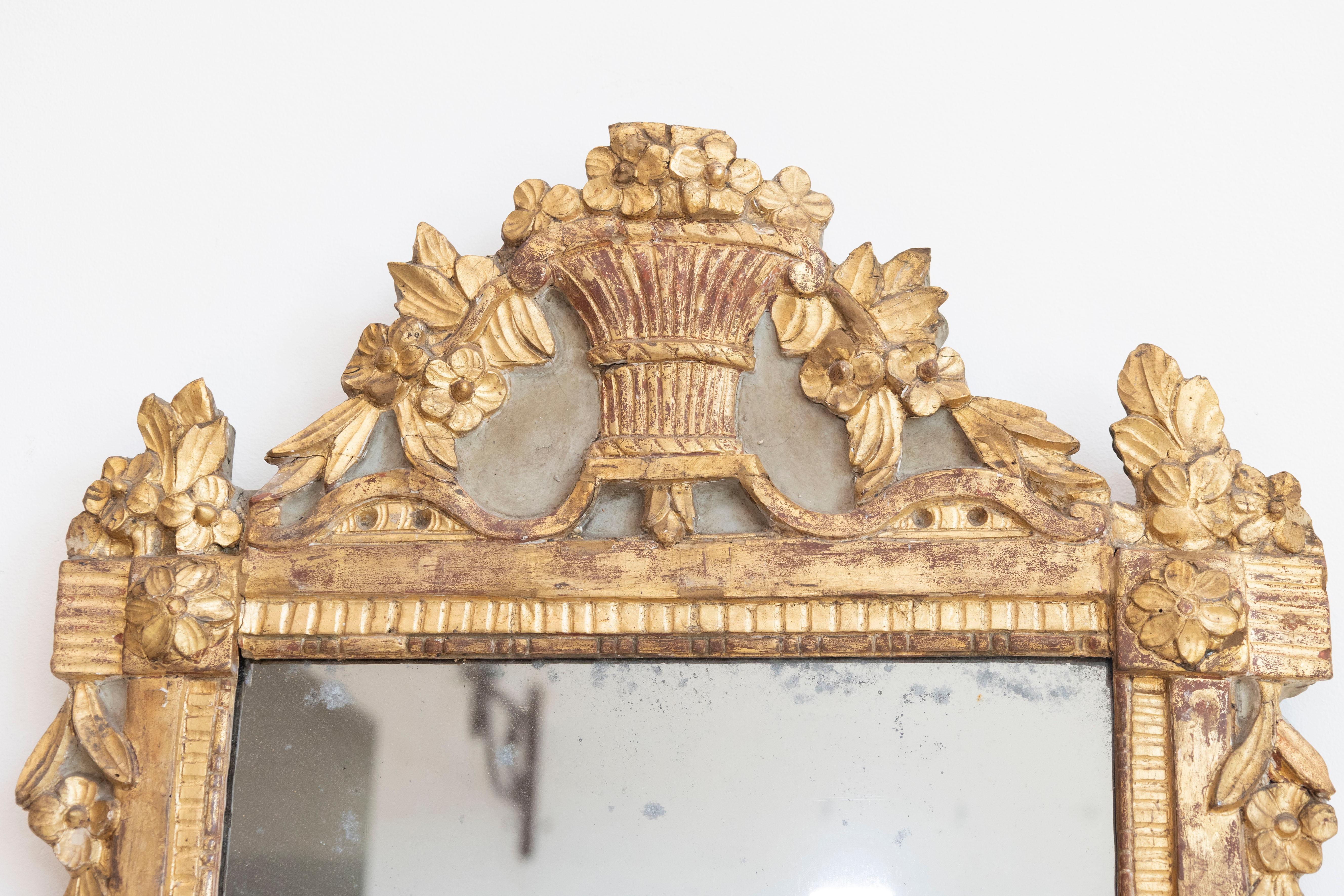18th Century and Earlier French Louis XVI 18th Century Giltwood Mirror with Carved Bouquet of Flowers For Sale