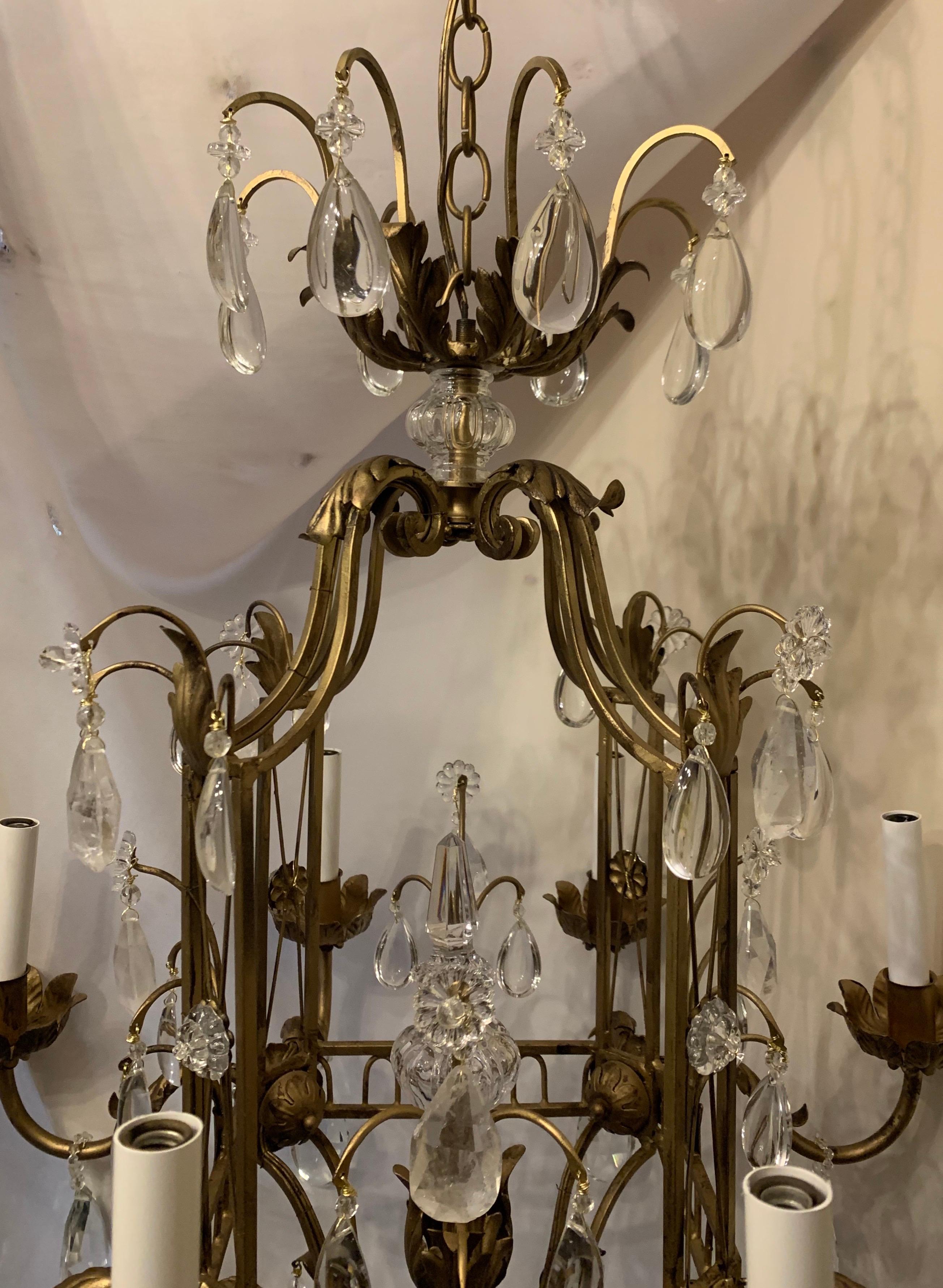 A wonderful French Louis XVI / Baguès style rock crystal eight candelabra light square midcentury flower basket form chandelier.