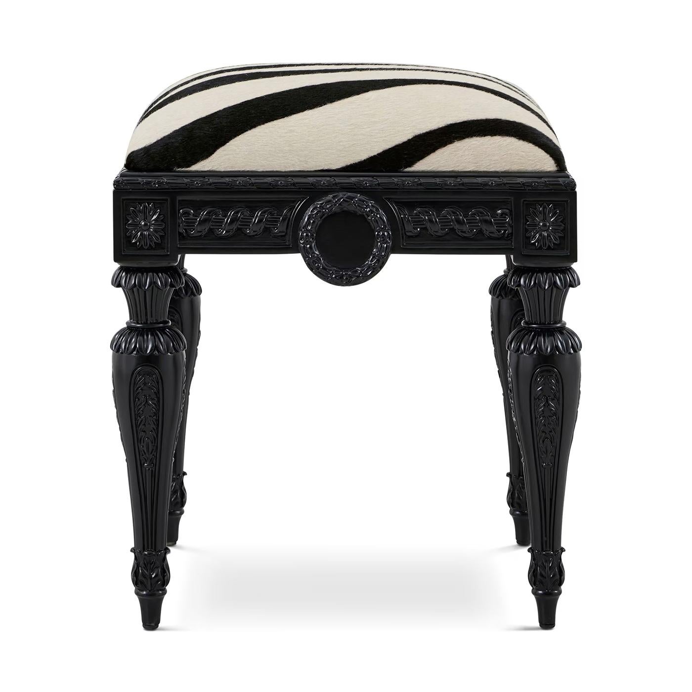 Crafted in the style of 18th-century France, this piece features intricately hand-carved floral rosettes, fluted legs, and guilloche-style motifs. Its deep black lacquered frame exudes refinement, while the zebra-patterned upholstered seat adds a
