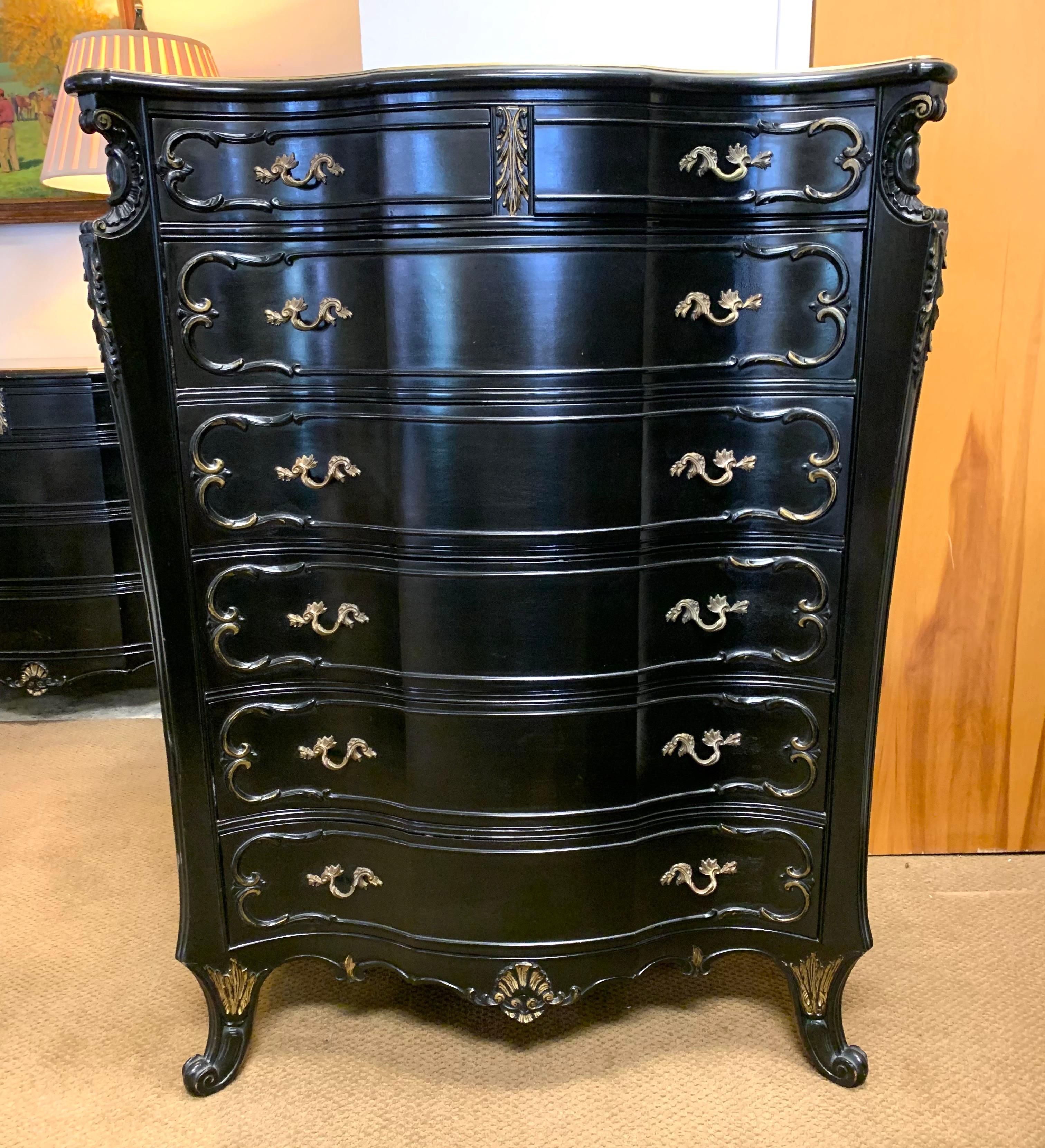 This fine quality vintage French style dresser has been refreshed with black paint and gold accents. It has six dovetailed drawers.
      