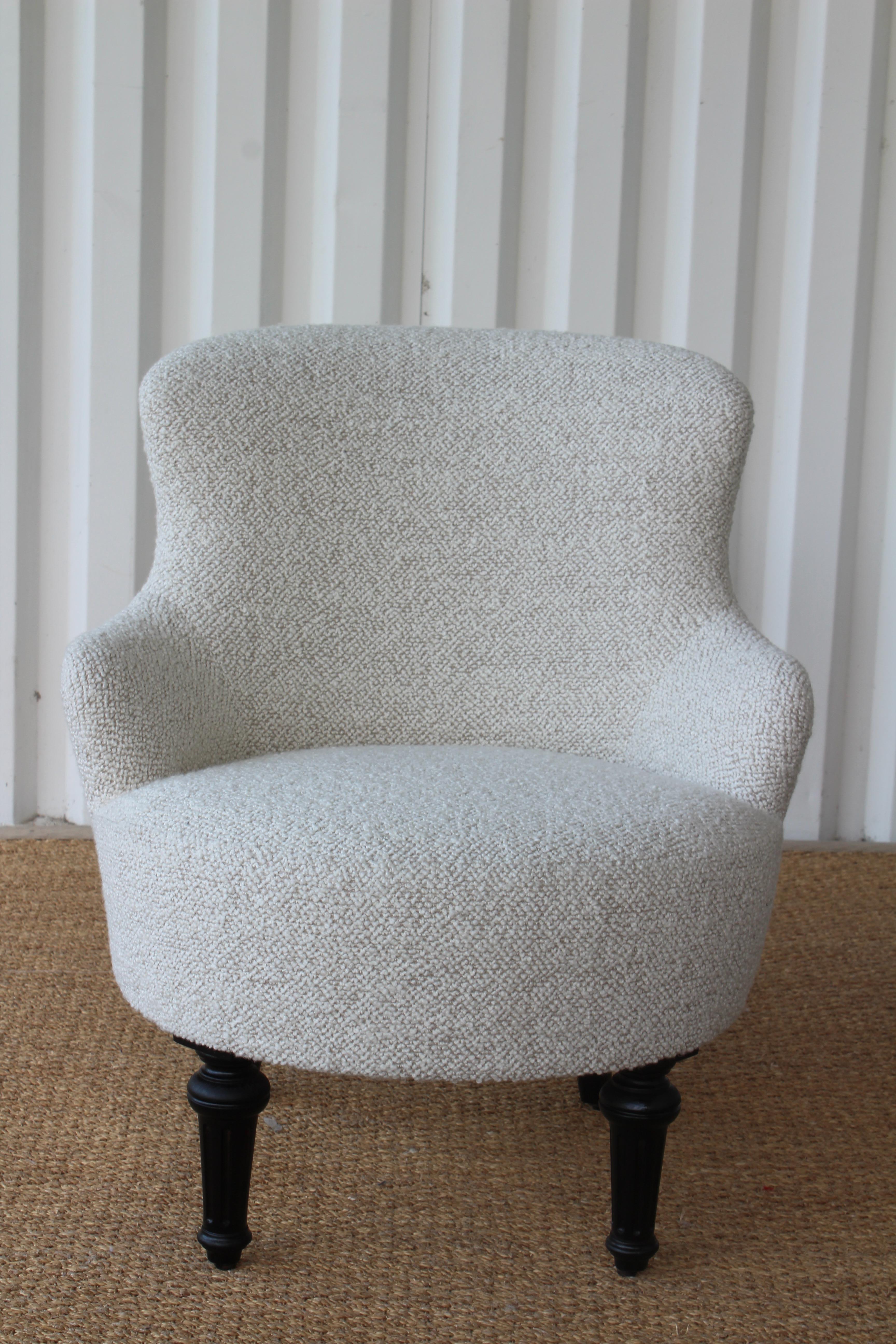 Vintage French boudoir chair. Reupholstered in a nubby wool blend bouclé. The walnut legs have been refinished satin black. In excellent condition.
