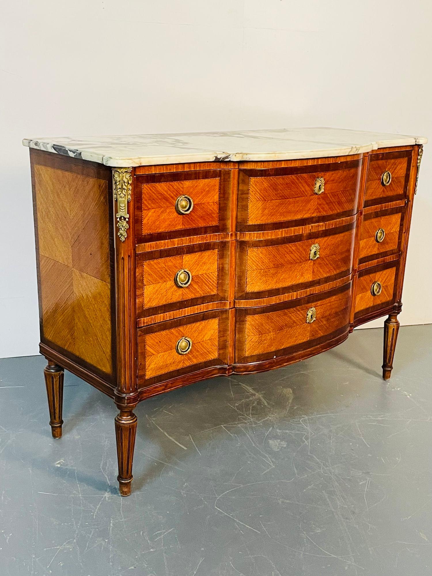 French Louis XVI bronze mounted bow front commode, chest, or dresser, marble top
 
Late 19/ early 20th century commode, chest or dresser in the Louis XVI manner having a white and black veined marble top supported by a bow front center chest with