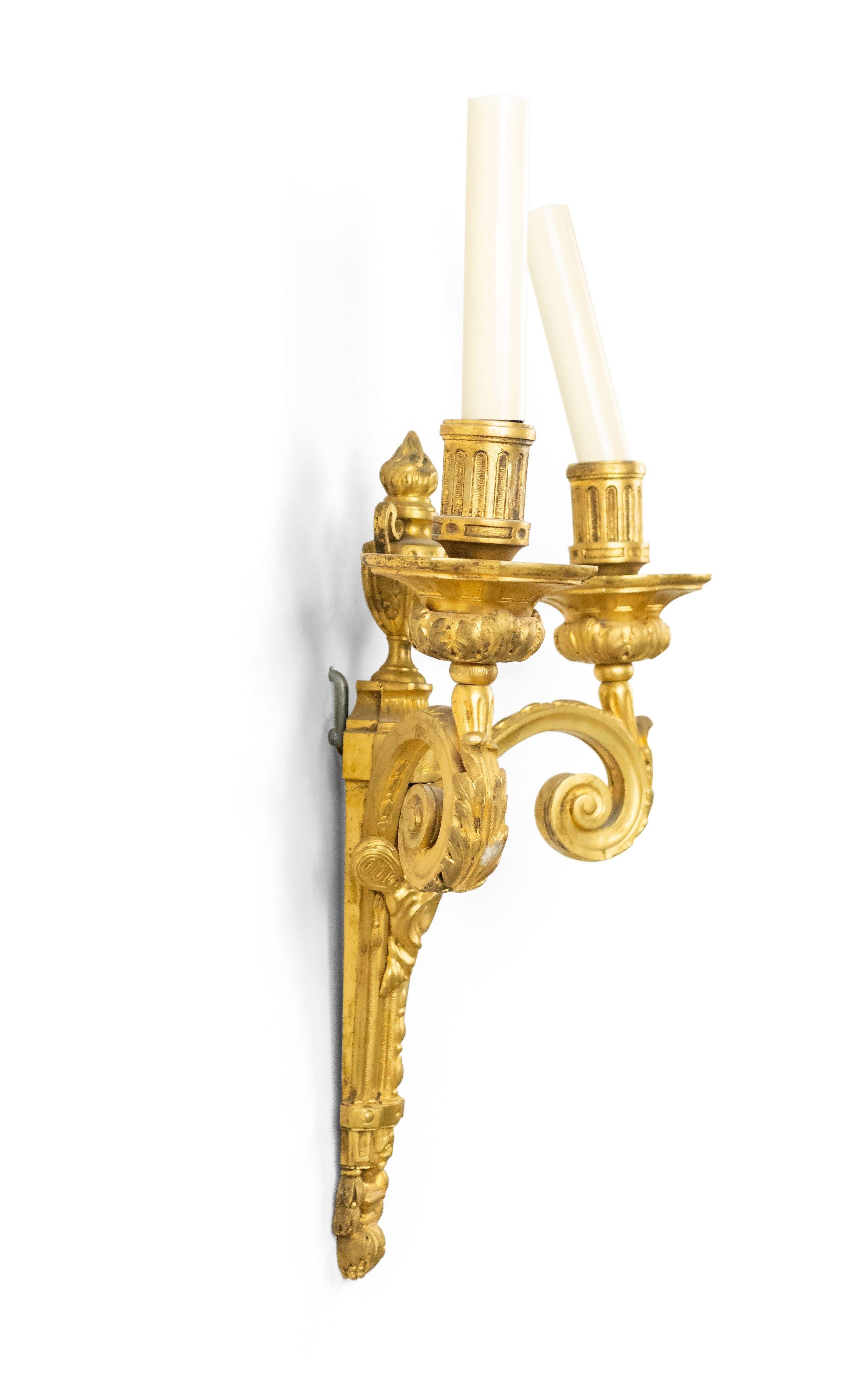 French Louis XVI style 19th century bronze doré scroll 2-arm wall sconce with cupid head and urn top.