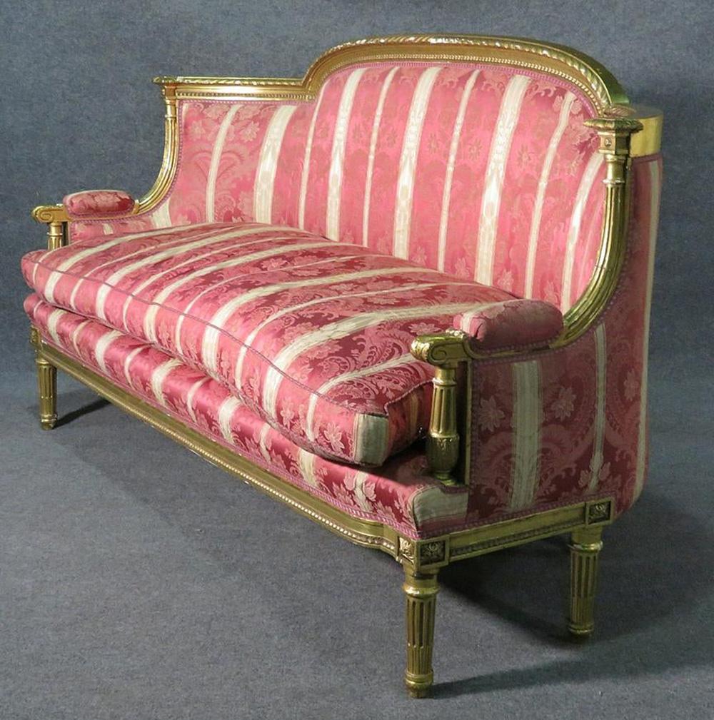 Some minor losses to gold leaf. Stains to upholstery. Measures 44 3/4