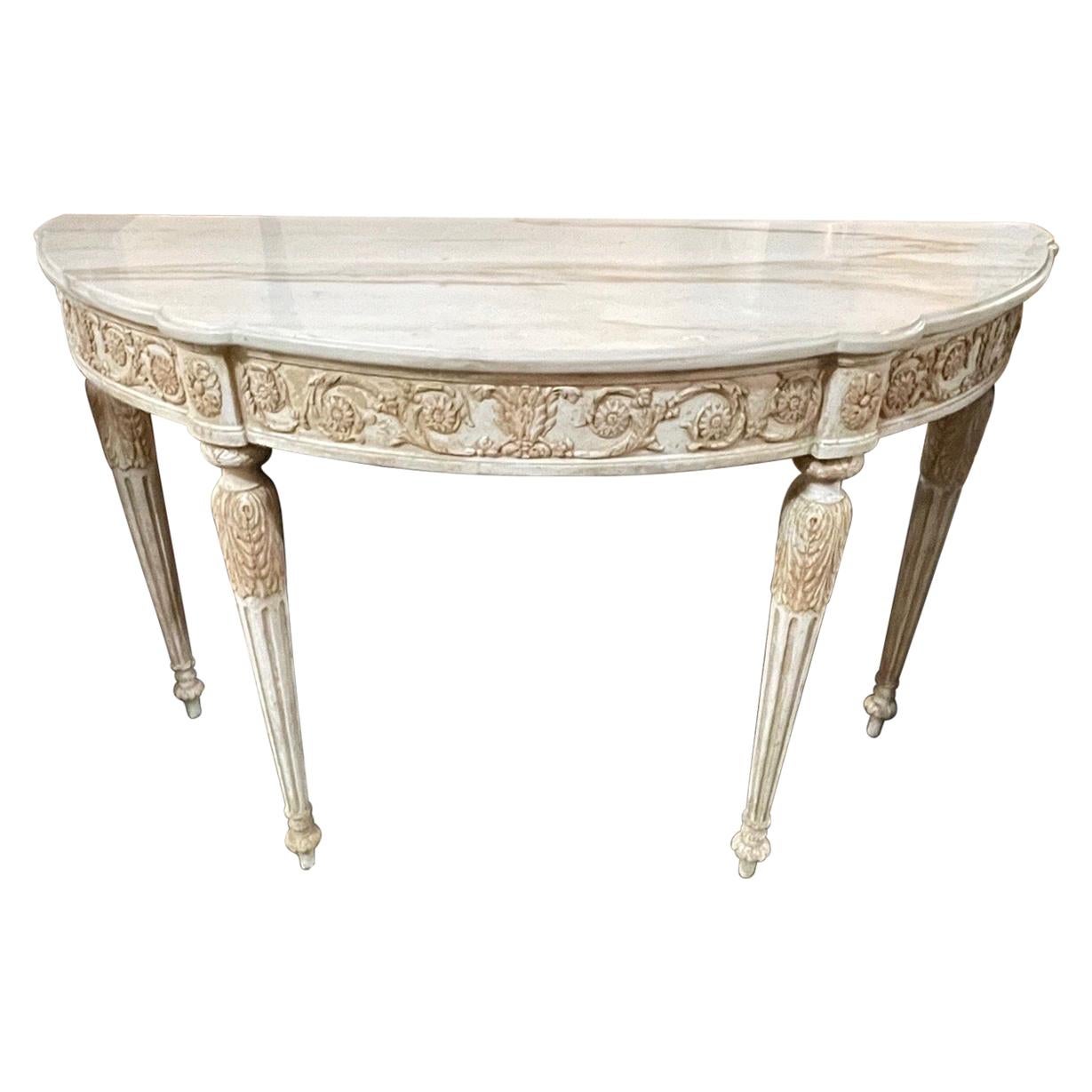 Superb French Louis XVI carved and painted console with onyx top. The carvings on this piece are truly exceptional and the patina is beautiful as well. Stunning!!