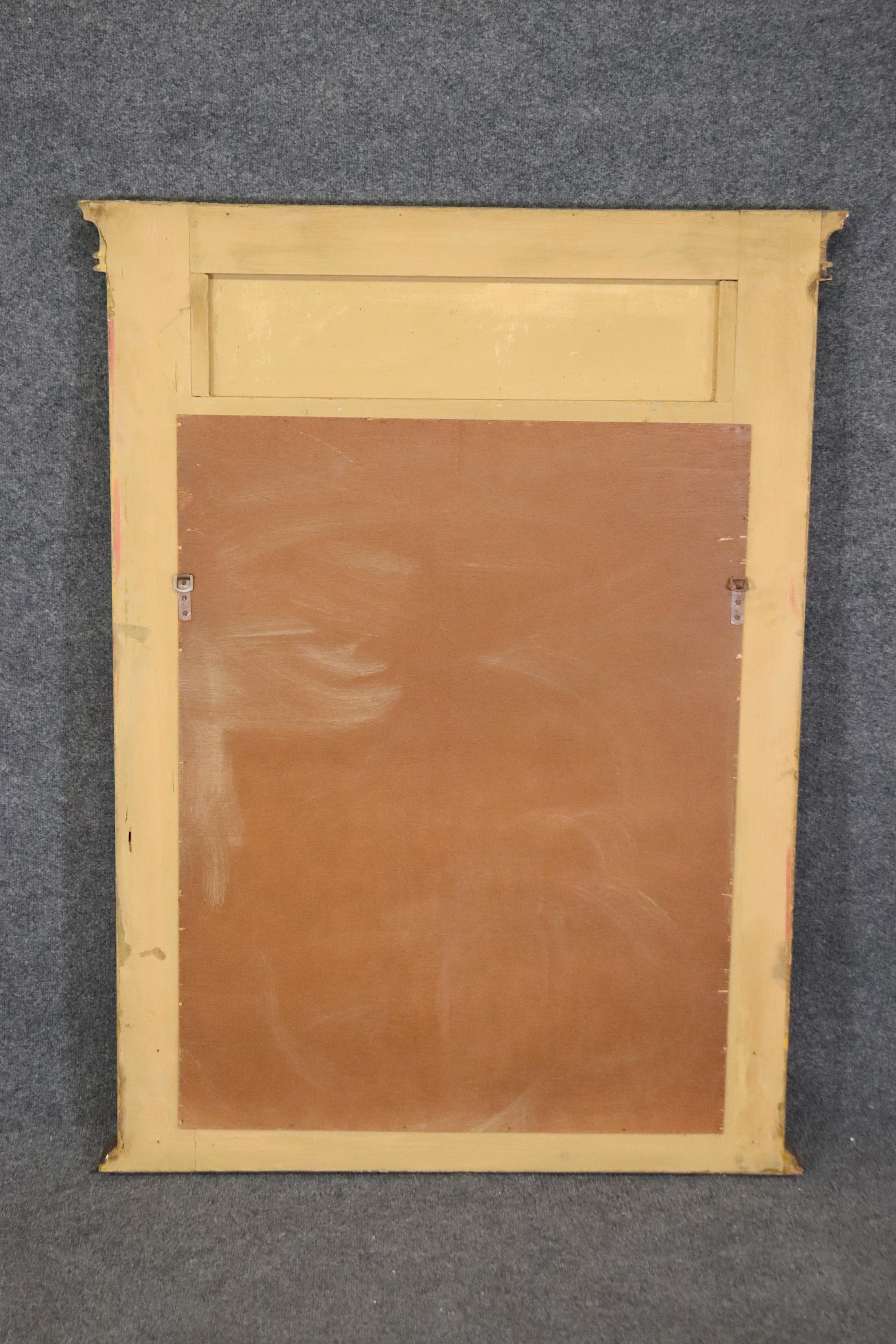 Dimensions- H: 52 1/4in W: 39 3/4in D: 3in

This vintage French distressed trumeau wall hanging mirror is an exceptional example of mid 20th century decor!  If you look at the photos provided, you can see the intentionally distressed finish and
