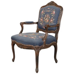 French Louis XVI Carved Walnut and Needlepoint Upholstered Armchair, circa 1950 French Louis XVI Carved Walnut and Needlepoint Upholstered Armchair, circa 1950