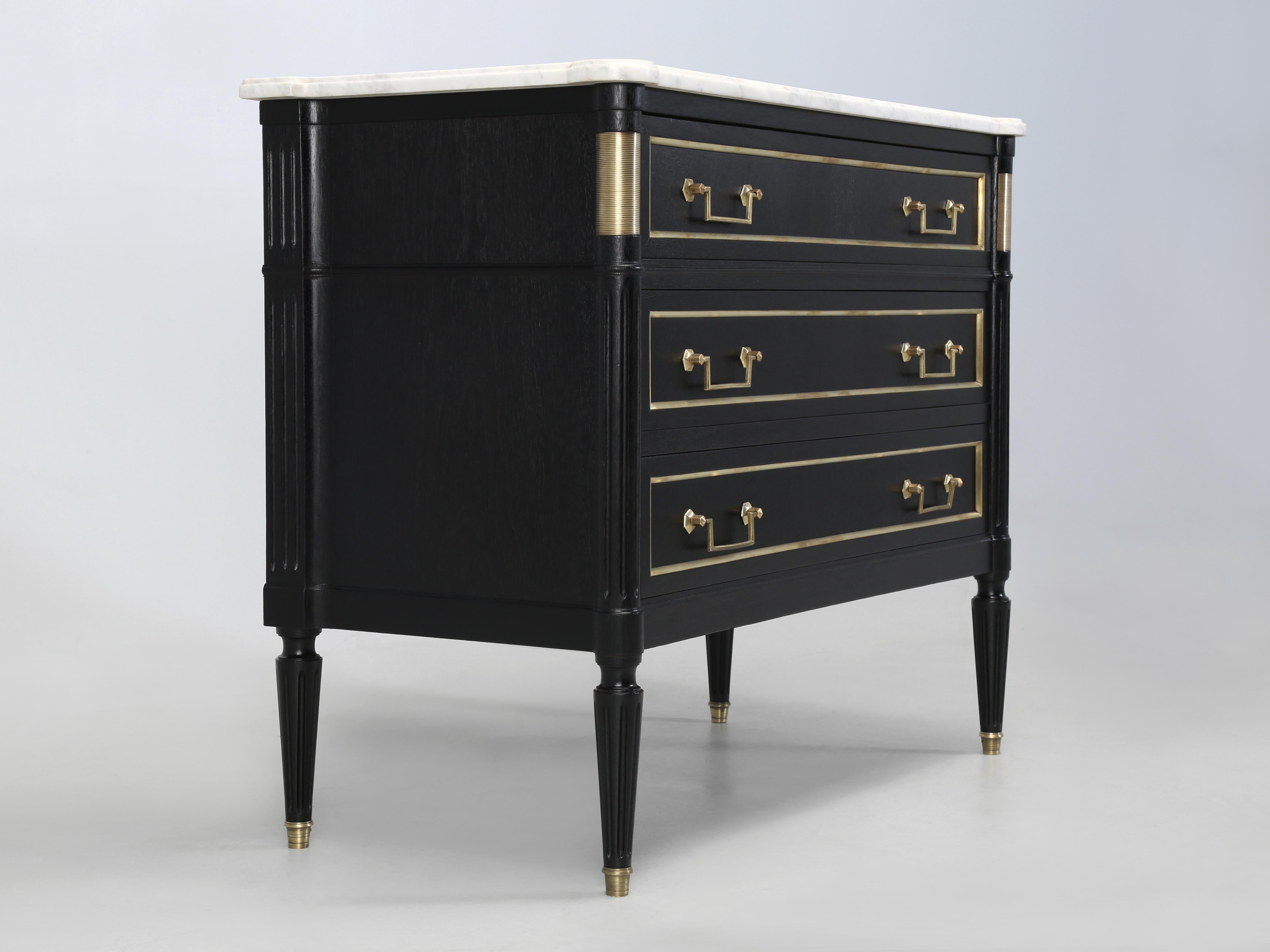 French Louis XVI Commode with its Original Marble Top. Our Old Plank Restoration Department removed the old tired lacquer, without the use of any harsh chemicals and applied an old school Ebonized finish. During the restoration process the drawers
