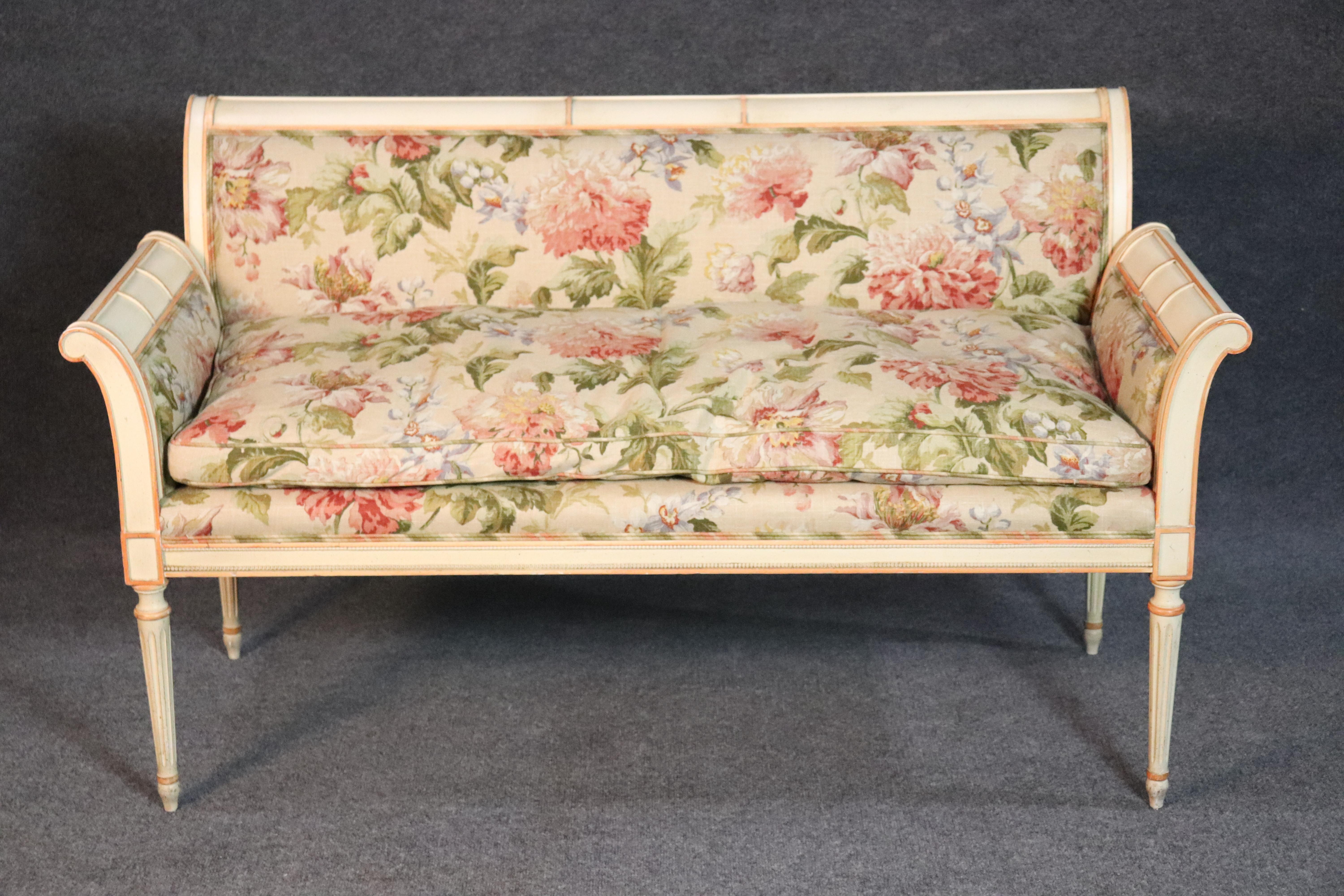 This is a beautiful and charming settee, with tons of quality and good taste! The floral linen upholstery is a very expensive fabric and is in excellent condition. The upholstery covers a genuine goose feather down cushion for maximum comfort. The