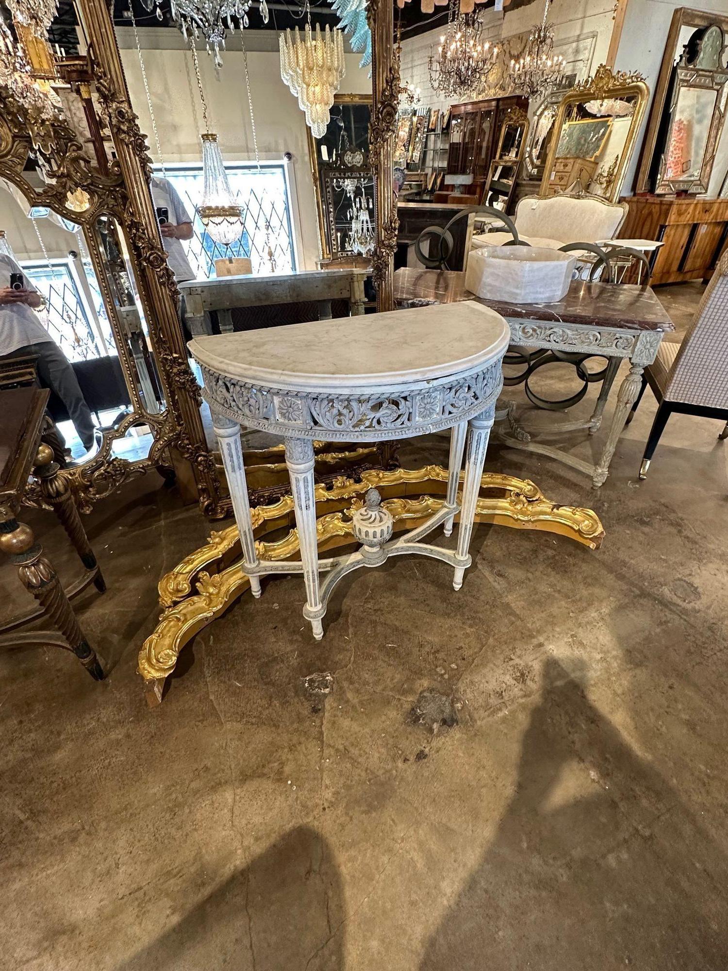 Vintage French Louis XVI carved and painted demi-lune console. Circa 1940. A timeless and classic touch for a fine interior.