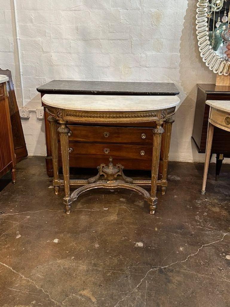 19th century French Louis XVI carved and giltwood demi-lune console. Circa 1870. Perfect for today's transitional designs!
