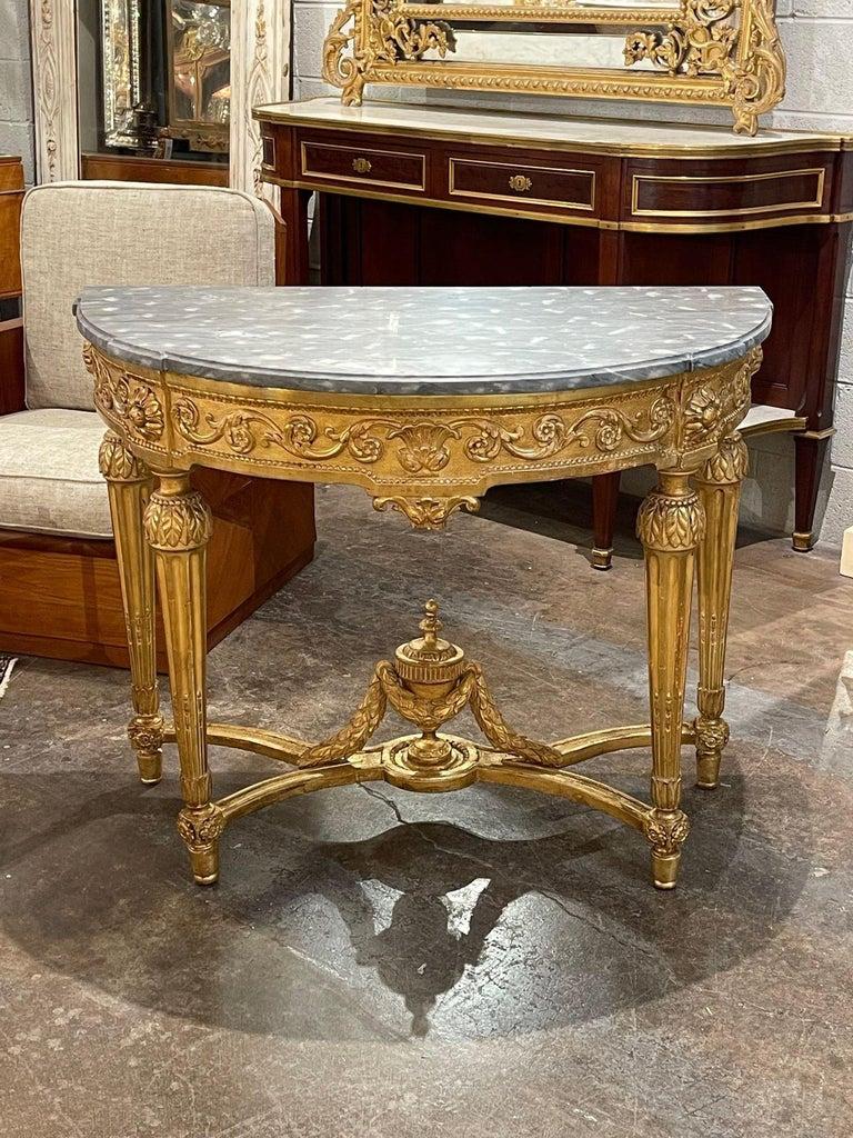 Fine quality 19th century French Louis XVI carved and giltwood demi-lune console. Circa 1860. A timeless and classic touch for a fine interior.