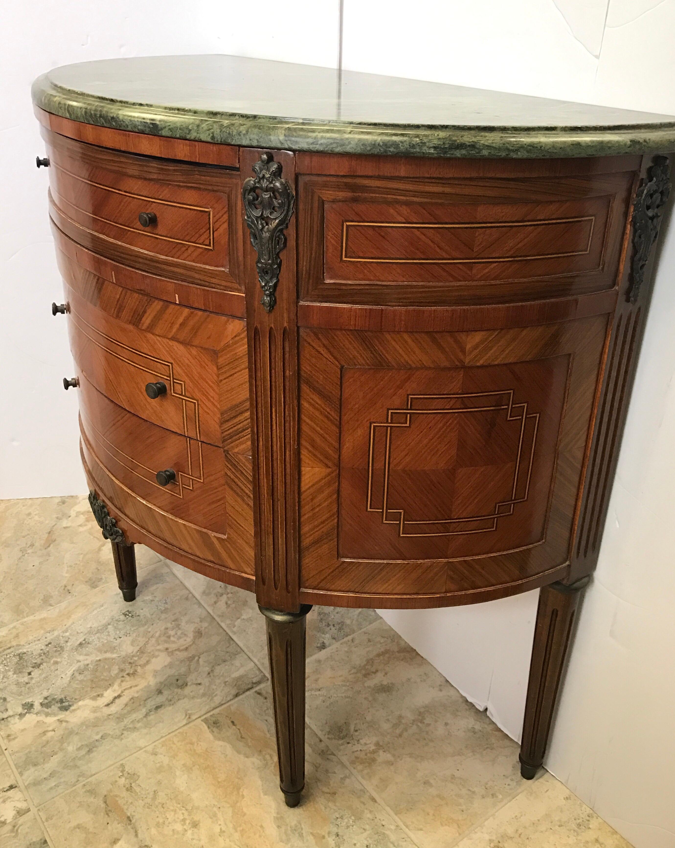 Elegant antique three-drawer French demilune with inlay and marble top that is removable. All original.