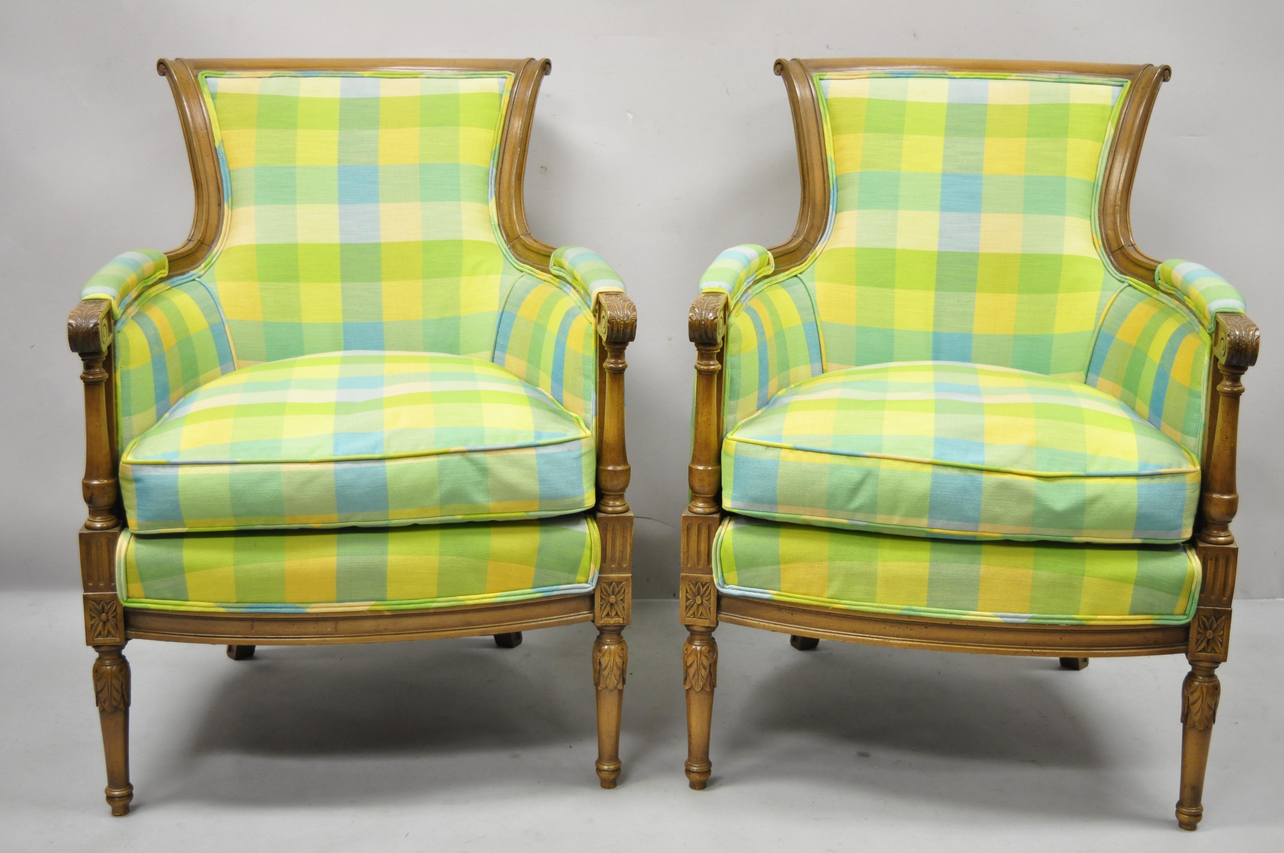 Vintage French Louis XVI Empire Directoire style green plaid bergère lounge arm chairs, a pair. Item features green, blue, and yellow plaid upholstery, curved back, solid wood construction, beautiful wood grain, tapered legs, very nice vintage pair,