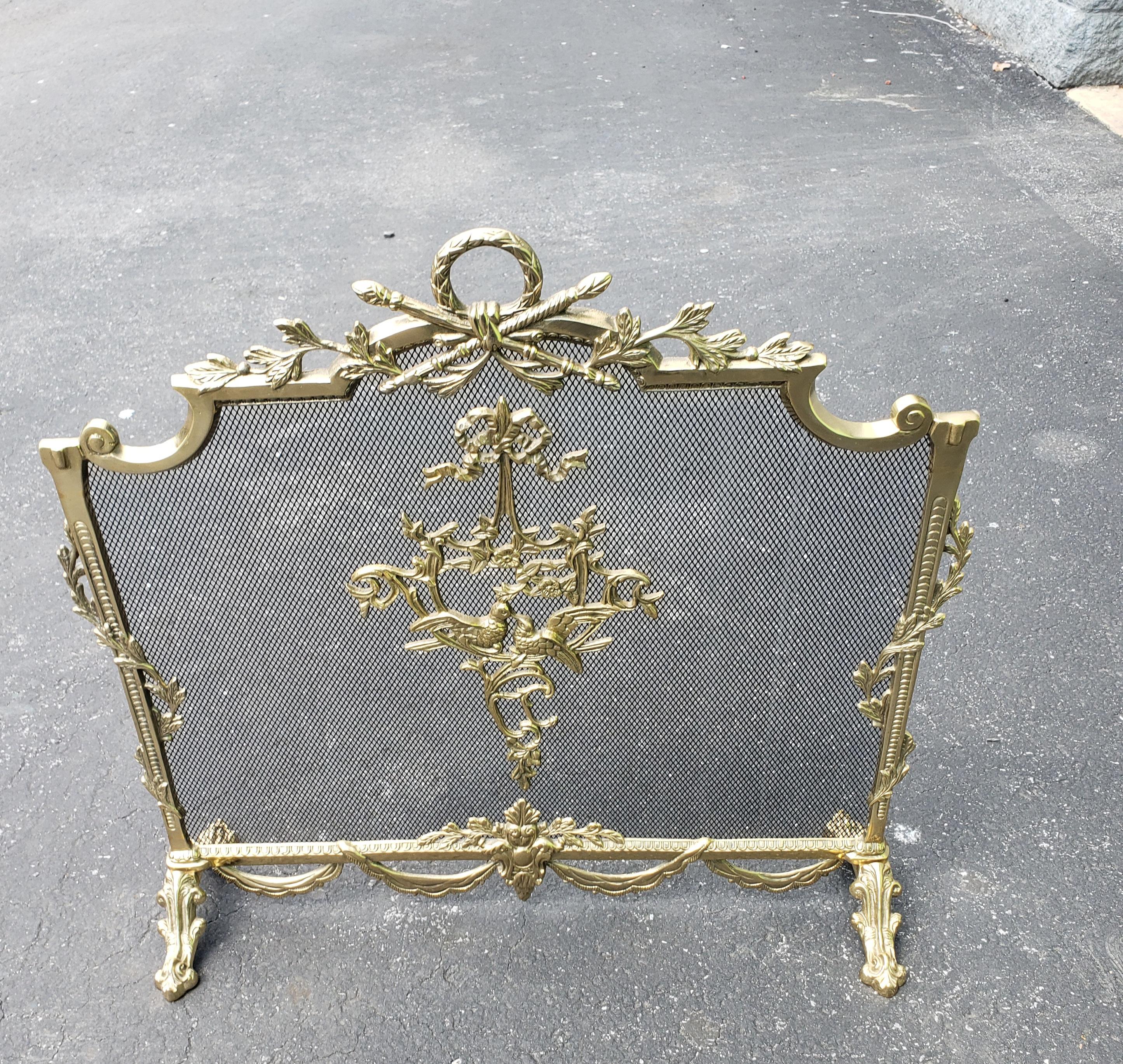 Exceptionally beautiful French Louis XVI Empire Style Ornate Brass Fireplace Screen in great vintage condition.