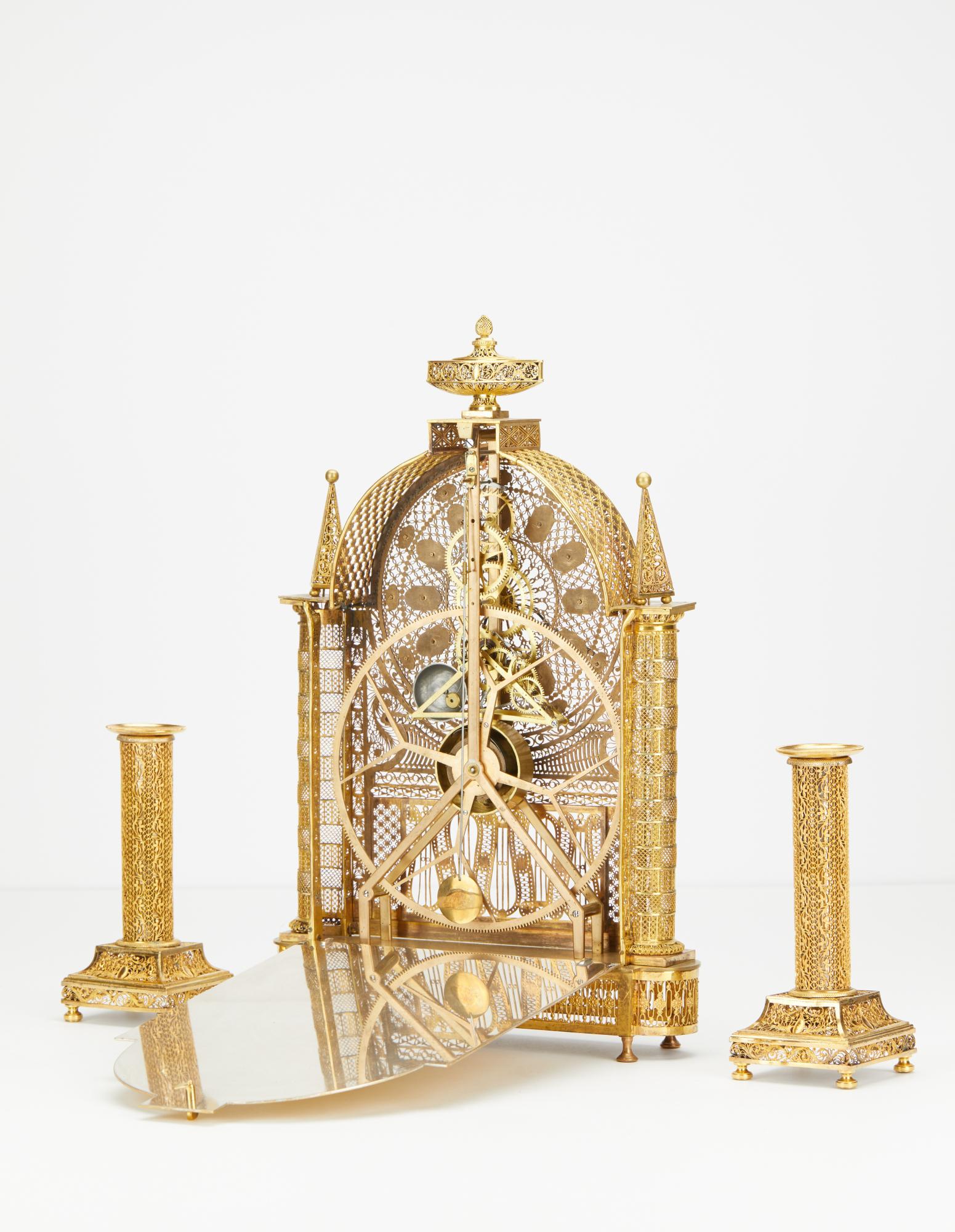 Gilt French Louis XVI filigree skeleton clock set  For Sale