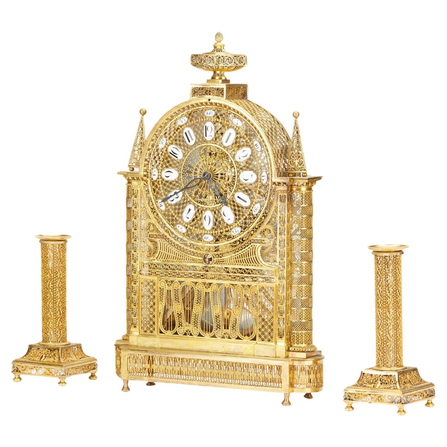 French Louis XVI filigree skeleton clock set  For Sale