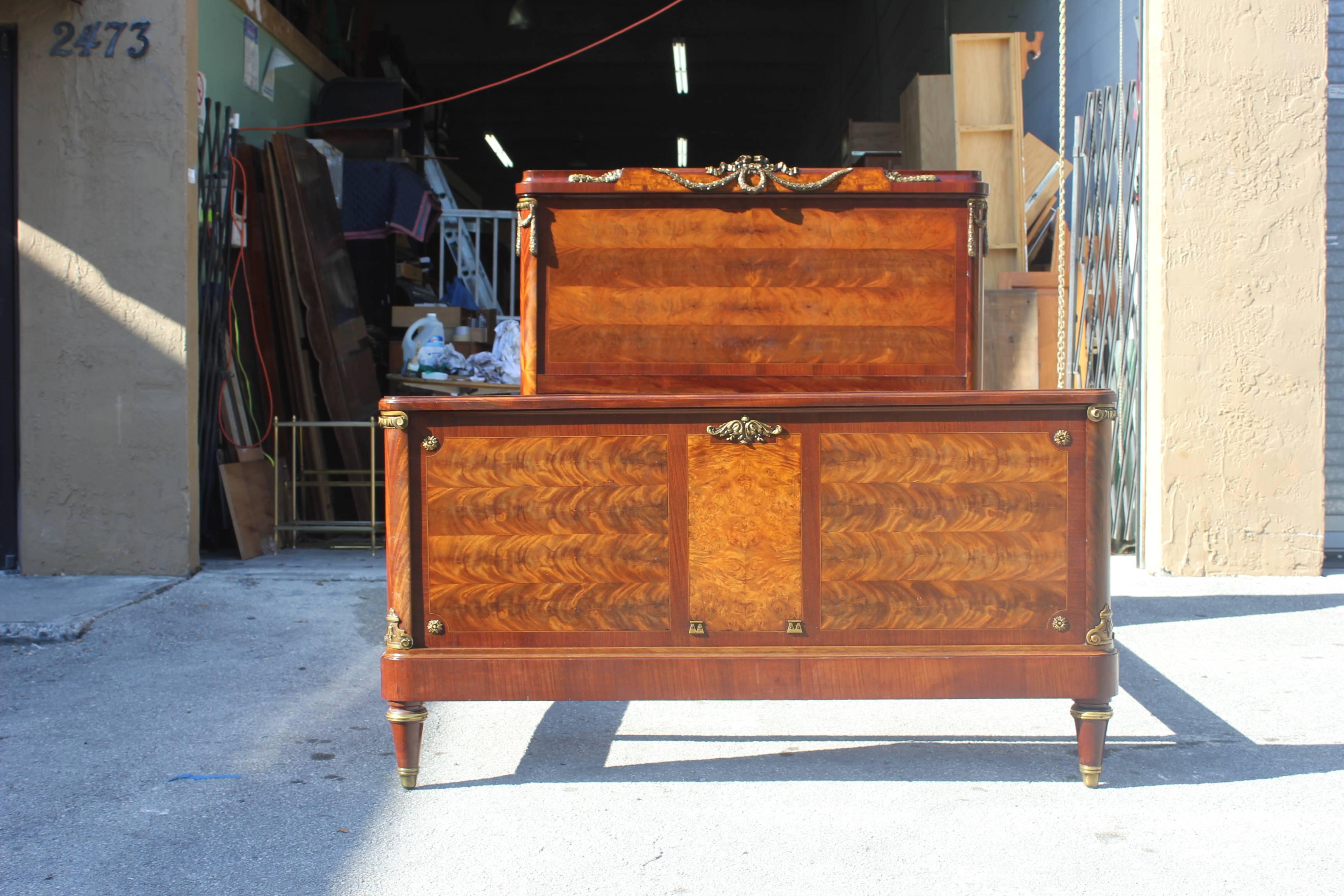 Beautiful French Louis XVI flame mahogany with bronze hardware ''Full'' beds, circa 1890s. Size 80 W, 57 D, 58.50 H. Please note these beds can be taken apart to accommodate elevator needs if necessary.