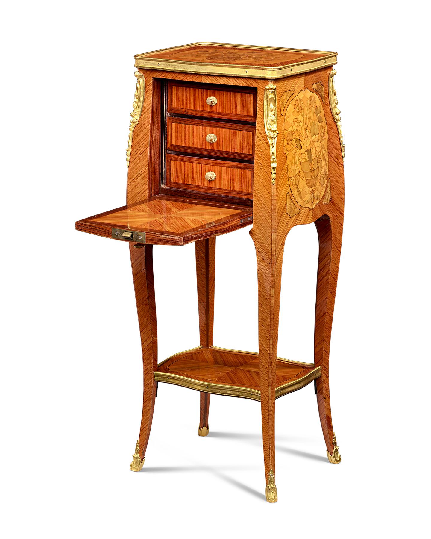 Eloquent marquetry and faithful interpretation of the Louis XVI taste characterize this beautiful French side table. The tabletop, sides and front panel all feature classical urns and baskets bursting forth with lush floral bouquets masterfully