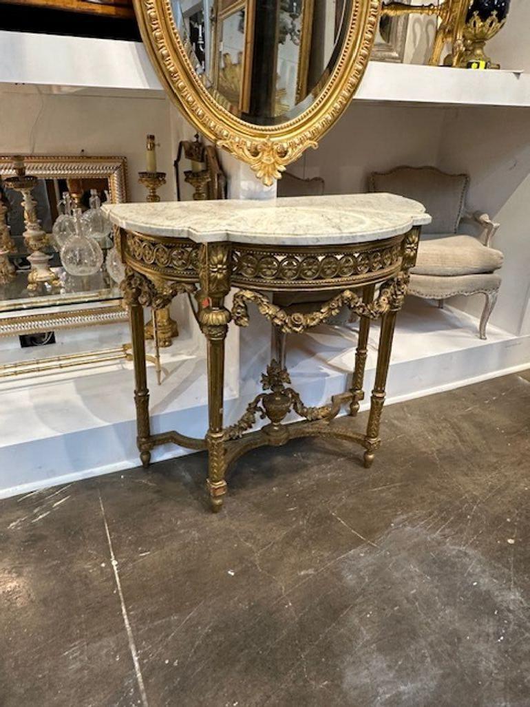 19th century French Louis XVI carved and giltwood console. Circa 1880. A fine addition to any home!