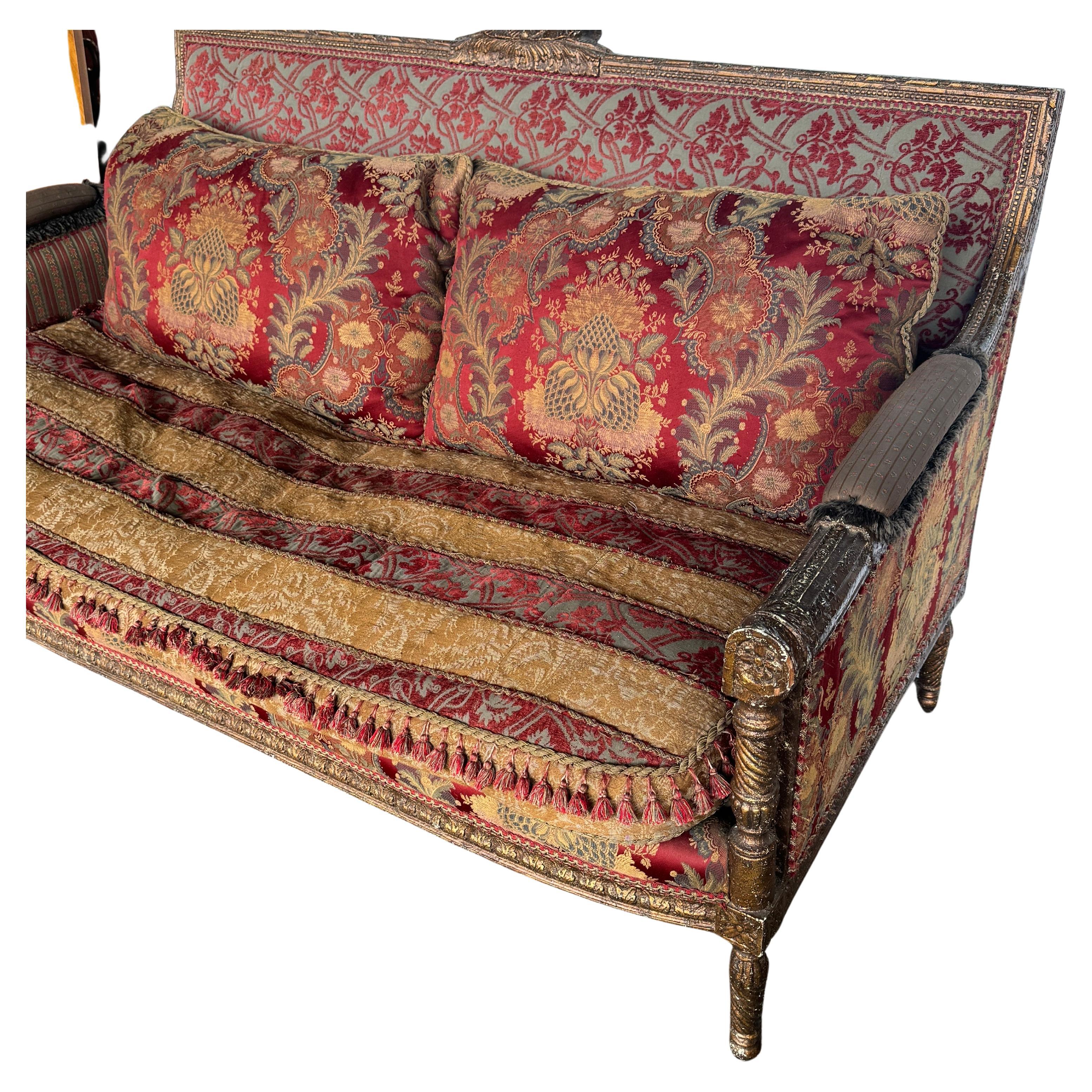 Large, cozy and impressive sofa from the Carol Hicks Bolton Collection. 
This collection emphasized ornate antique elements and rich fabrics. The details on this vintage piece are exquisite including high end fabrics and tassels. This sofa is