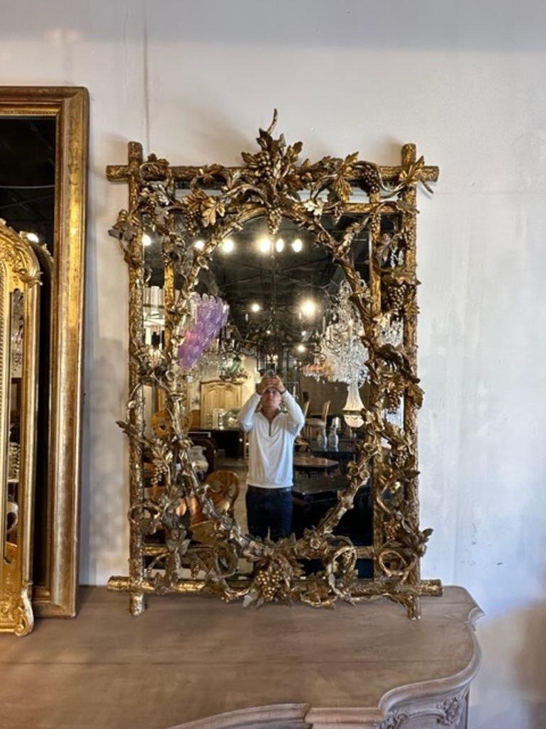 Rare 19th century French Louis XVI carved and giltwood tree form mirror. Circa 1860. Adds warmth and charm to any room!