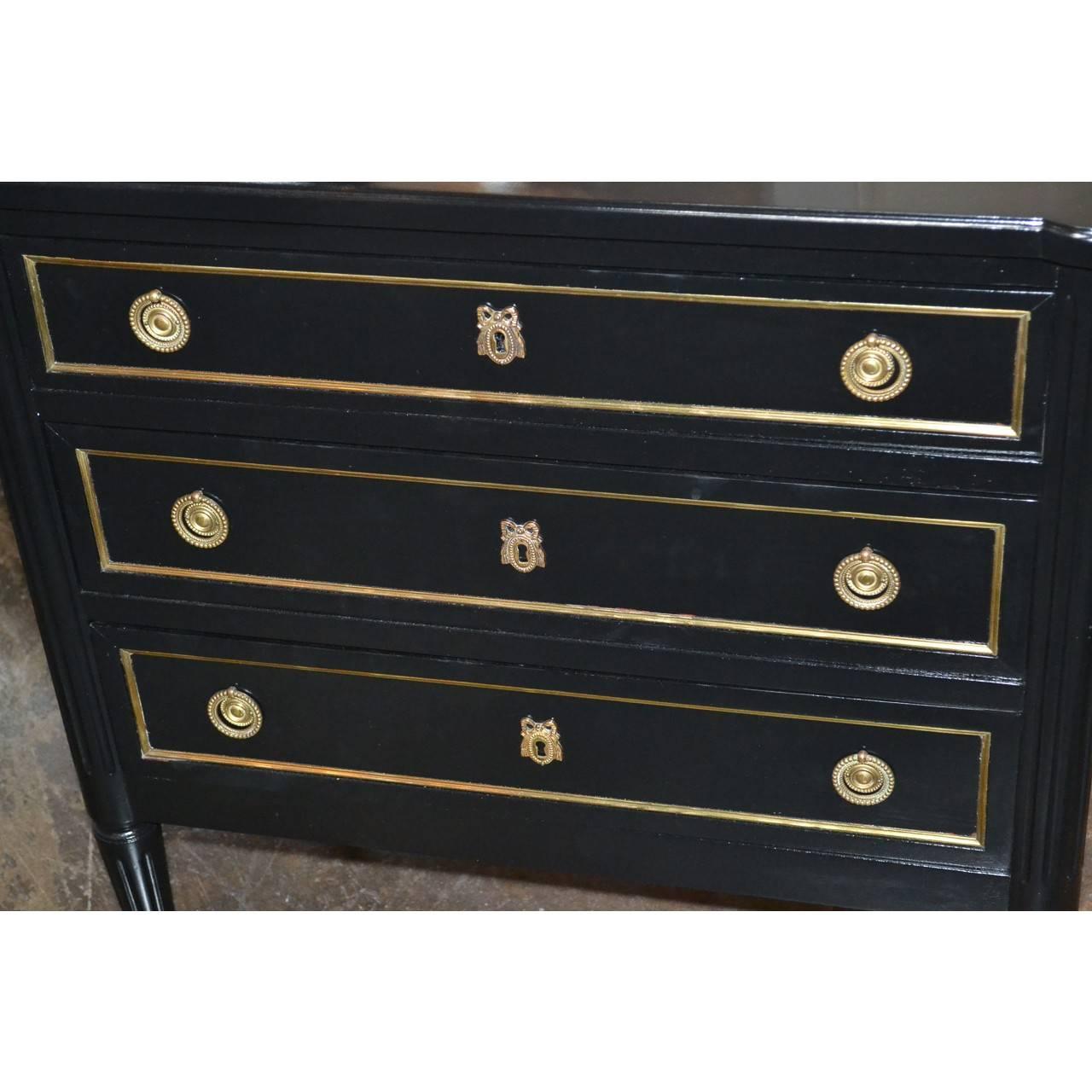 Beautifully scaled midcentury black lacquered chest with gilt bronze trim and pulls. 
Made in France, circa 1940.

30.5 inches wide x 30 inches height x 17 inches deep
 