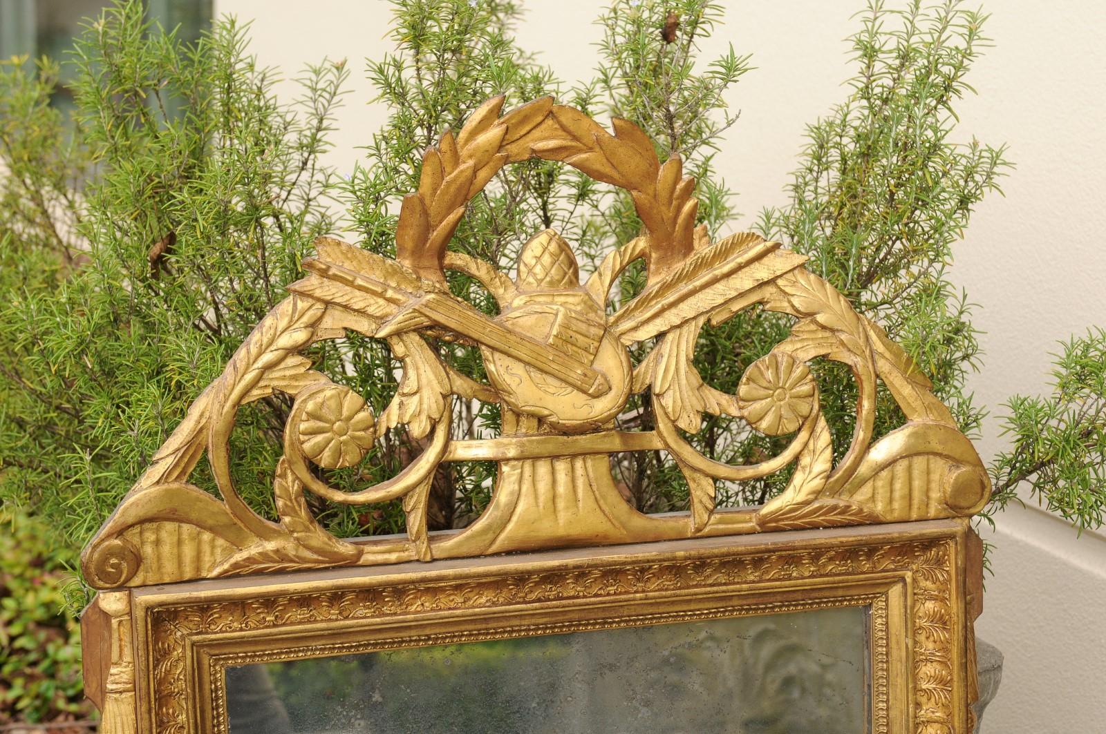 Miroir en bois doré de style Louis XVI, fin du XVIIIe siècle, à motifs d'arts libéraux en vente 1