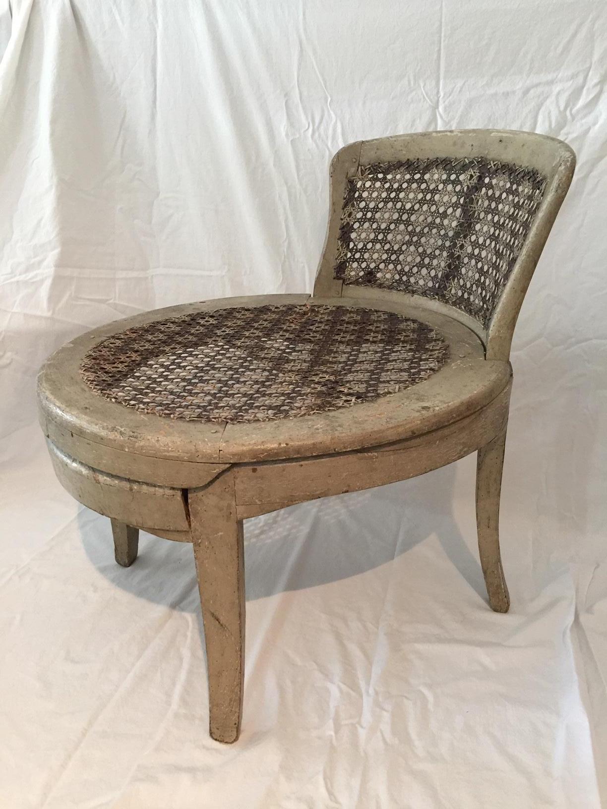 French Louis XVI low caned fireside slipper chair, 18th century.
This very rare and exceptional low chair is very old, and has withstood the test of time in a remarkably good state, with a minor loss to the base of the caning in a lower corner of
