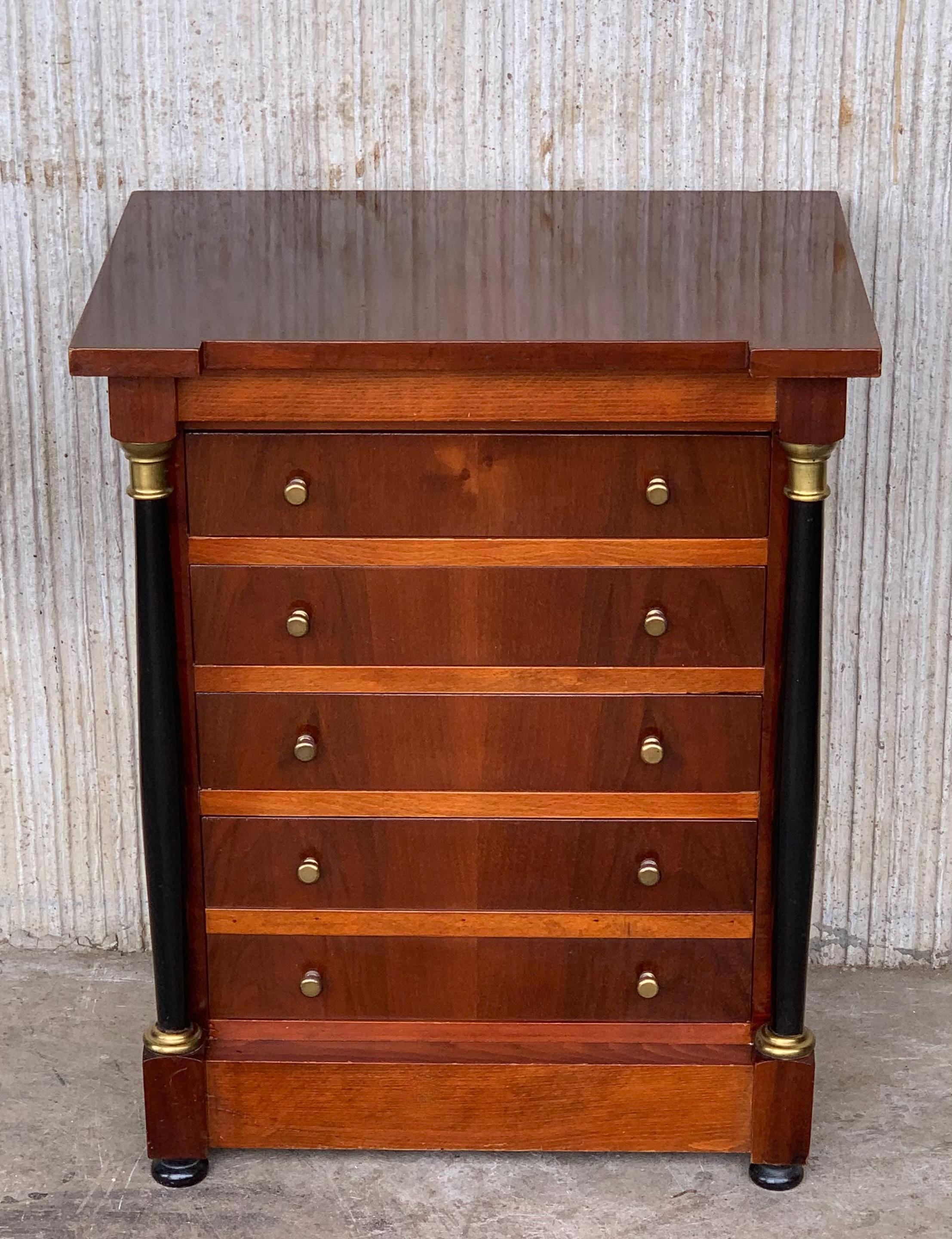19th century French Louis XVI black mahogany nightstands or side table with four drawers and ebonite columns in the sides.
The tables have two hidden trays in both sides for more uses.
