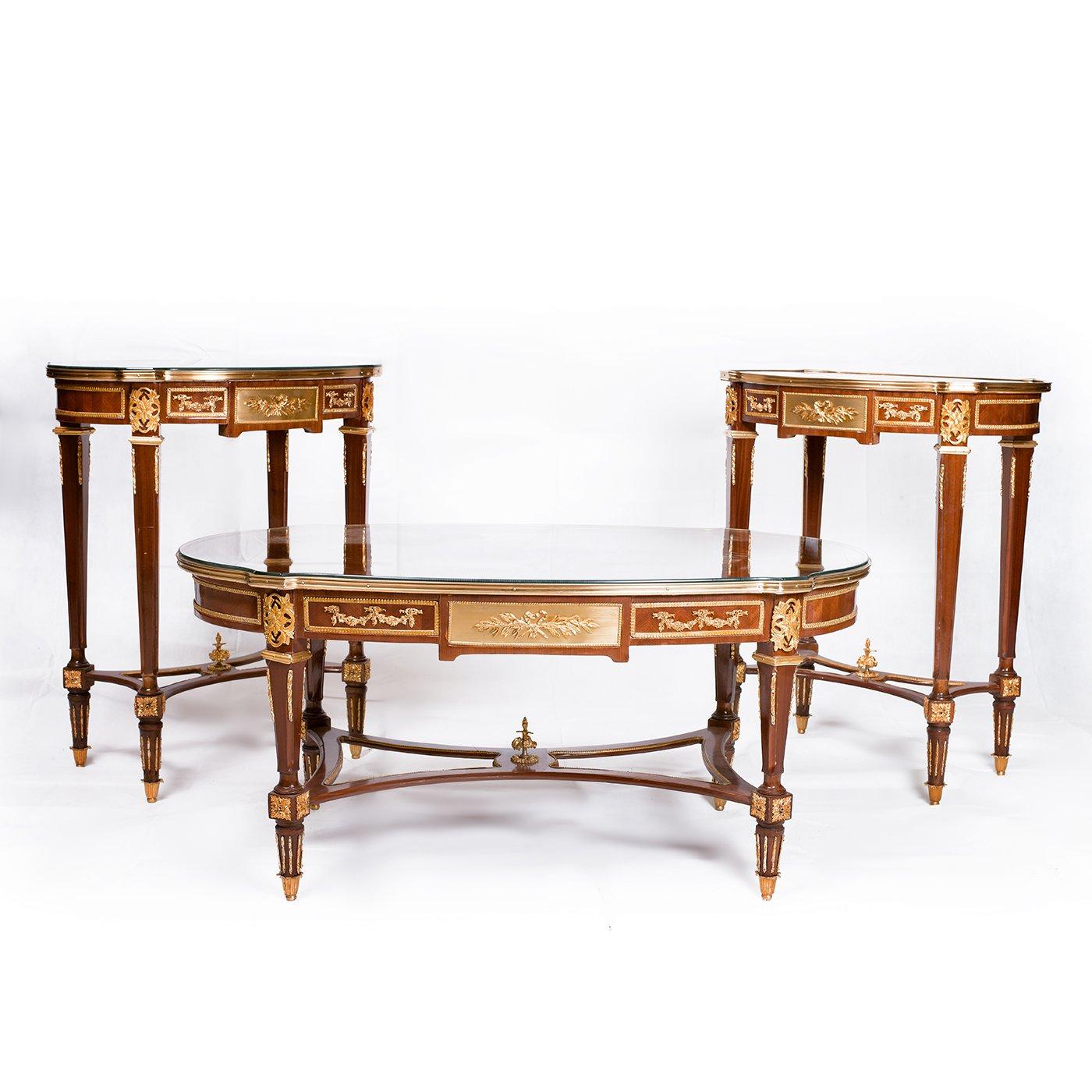 A beautiful French Louis XVI marquetry inlaid table (3 set), 20th century.

Superior Louis XVI style gilt-bronze and marqueterie inlaid table set made of beechwood, center table and pair of side tables, decorated with relief raised brass ornament