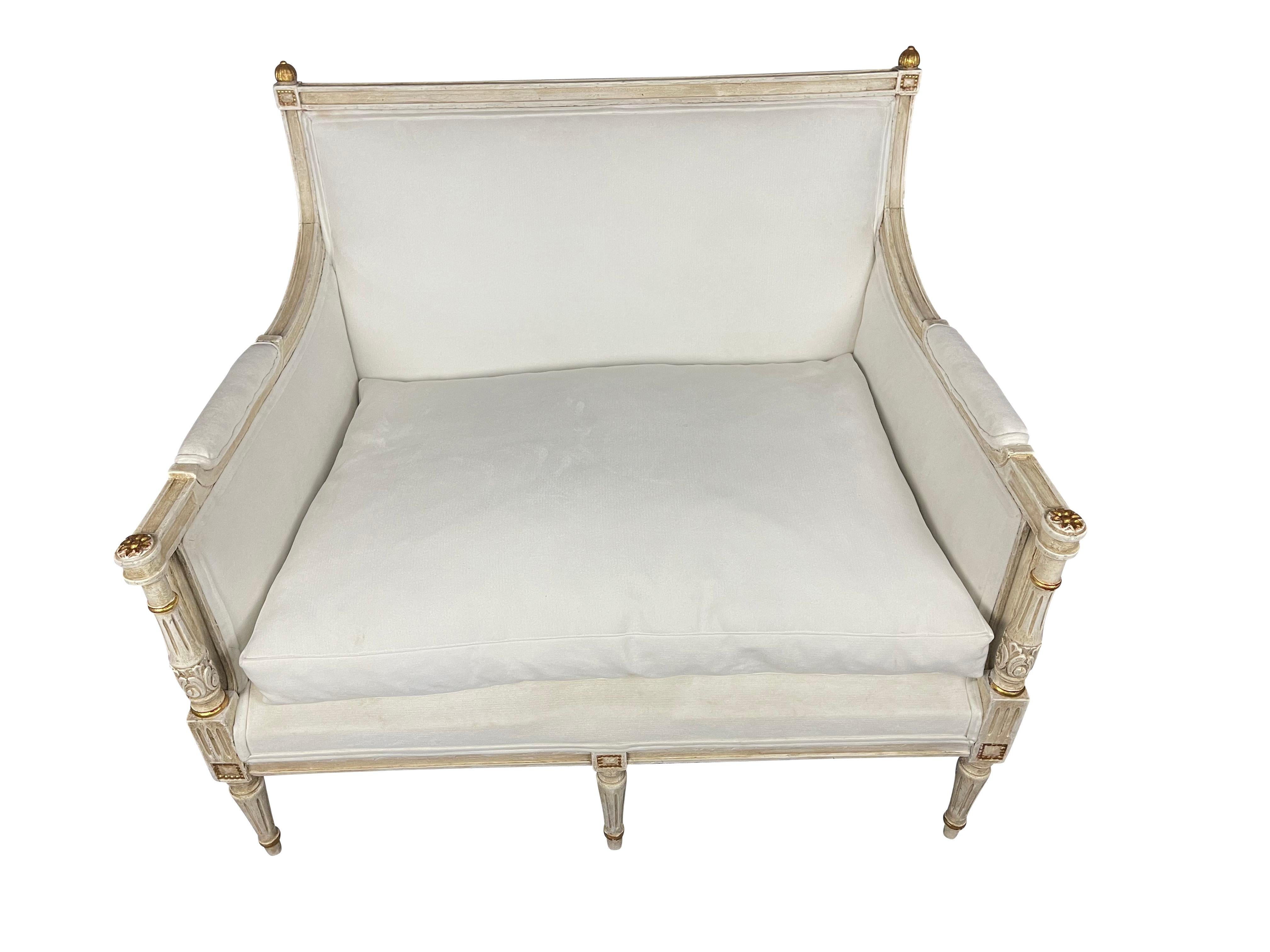 French 20th century Louis XVI style marquise armchair.

A French Louis XVI-style marquise wide seat chair from the early 20th century. This Louis XVI style chair, with its original paint, features a straight crest rail along the back, upholstered