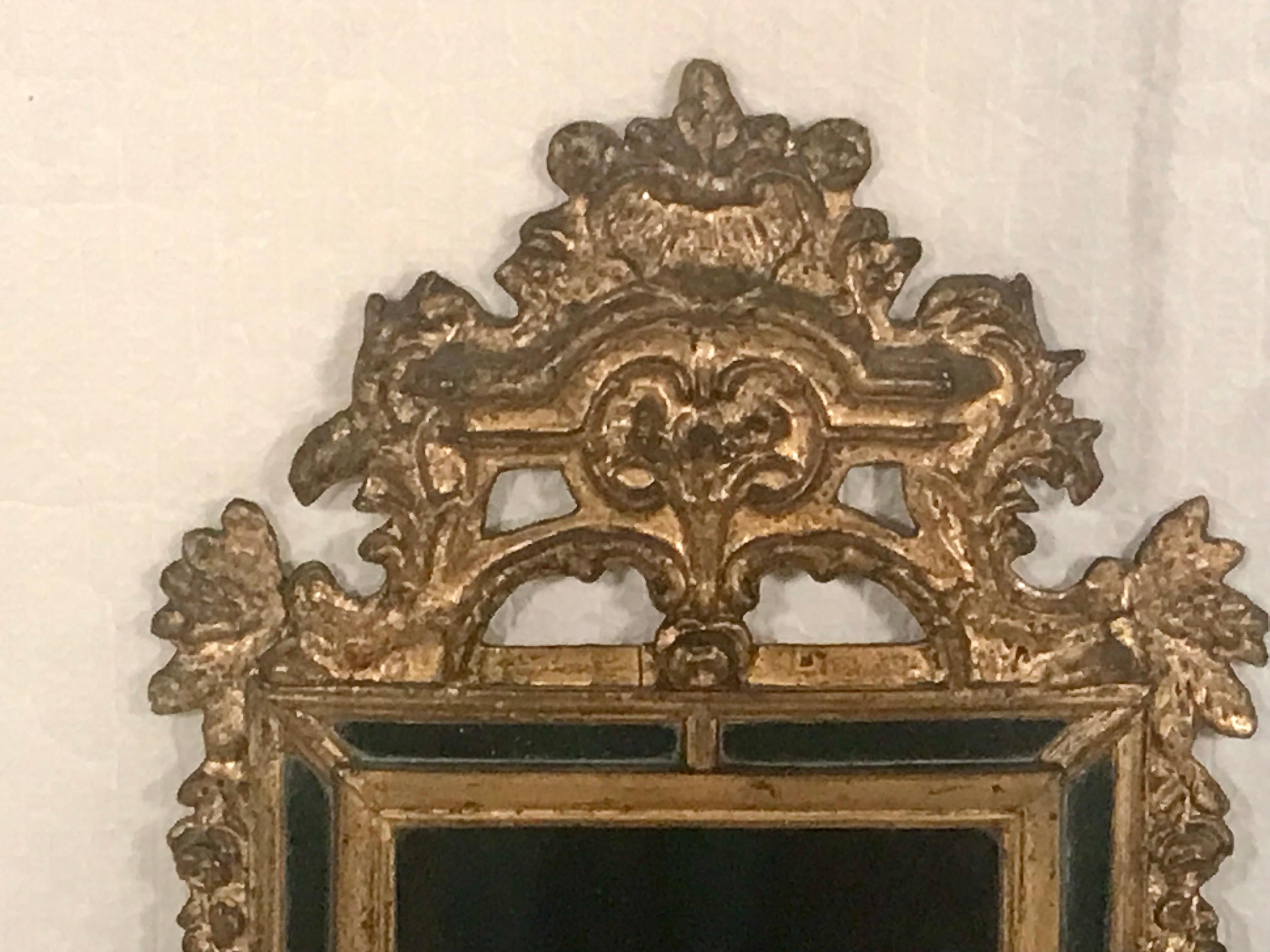 Embrace sophistication with our Neoclassical Mirror, crafted from gilt wood in France. Adorned with intricate flower and leaf tendrils, this mirror exudes timeless charm and classic beauty. Featuring original mirror glass, it remains in exceptional