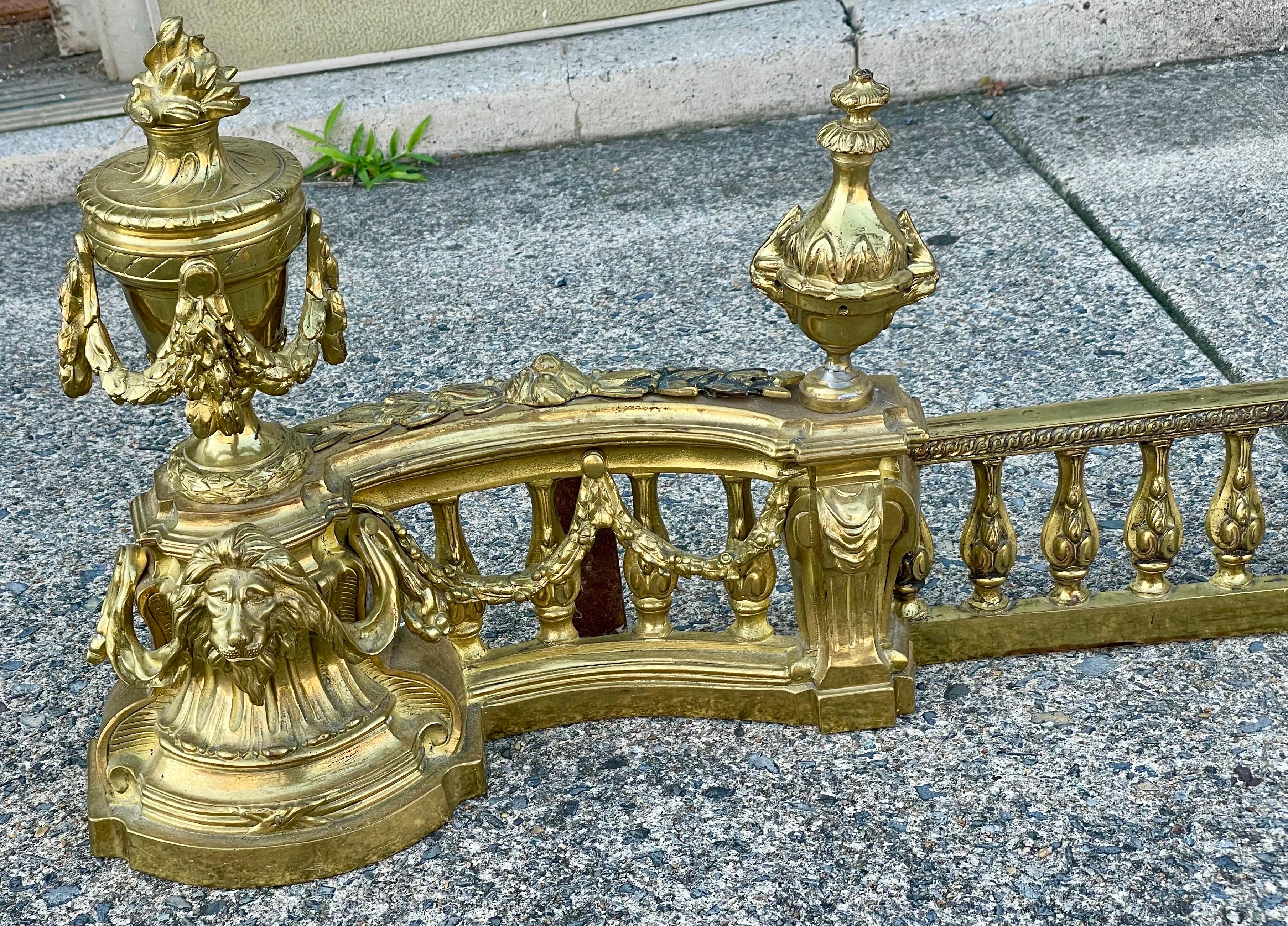 Unknown French Louis XVI Neoclassical Urn Lion Head Brass Fireplace Chenets & Fender Set For Sale
