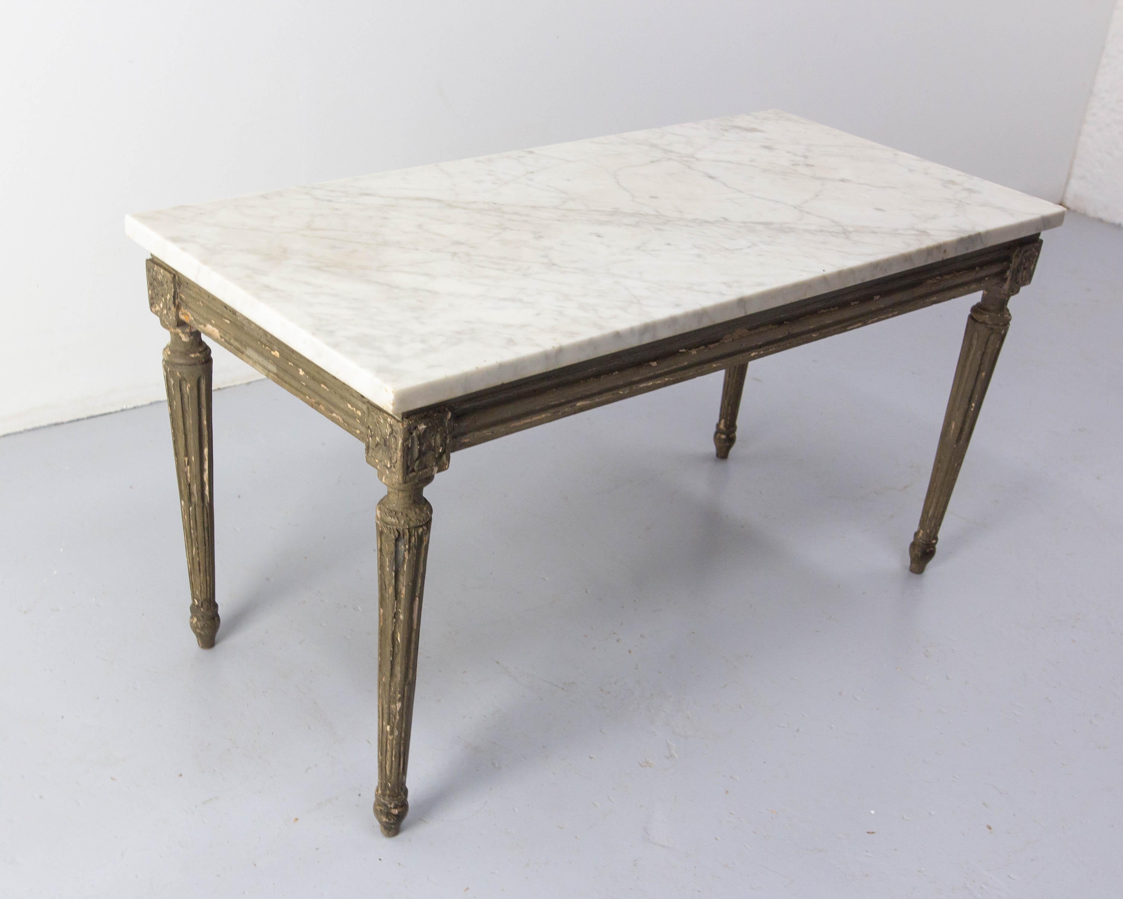 French Marble and wood coffee table.
The wood part of this table is made of a 19th century bench which was covered of a caned part.
With a beautiful marble plaque, this former bench has become a unique coffee table full of character.
In good
